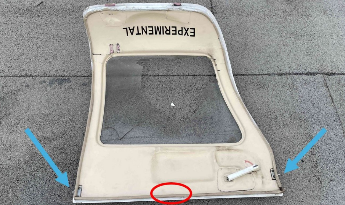 Investigators found the left cabin door of the Van's Aircraft RV-10 that crashed January 2 on the roof of the same warehouse that the airplane struck while attempting an emergency landing at Fullerton Municipal Airport. Blue arrows point to the primary door latches, and the area where a secondary latch should have been installed is circled in red. NTSB image.