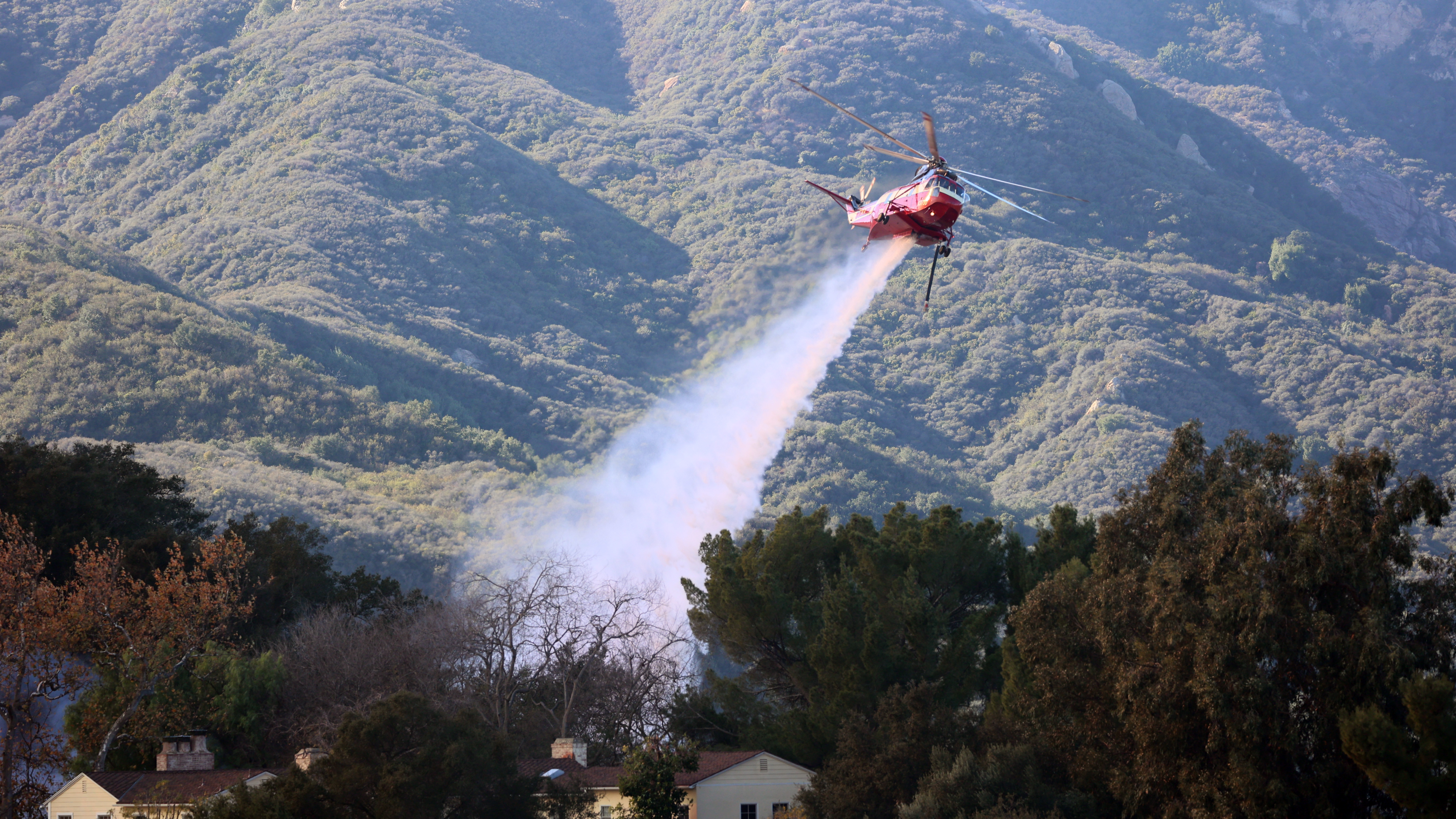 A helicopter attacks the Palisades Fire on January 9. Photo courtesy of Cal Fire.