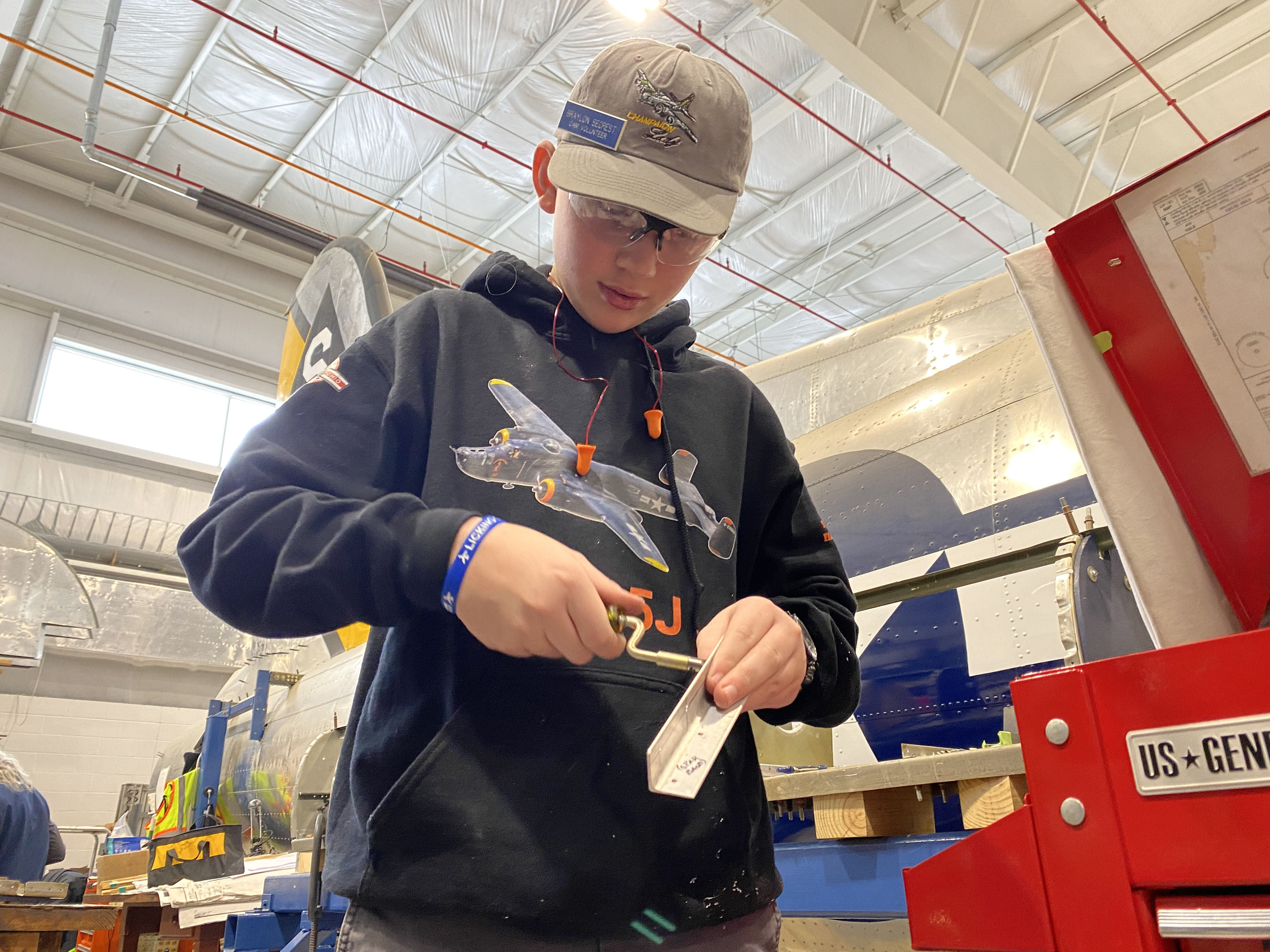 Volunteers, including youth, are welcome to work alongside the craftsmen at the Champaign Aviation Museum and Mid-America Flight Museum Restoration Hangar. Photo by Alyssa J. Cobb.