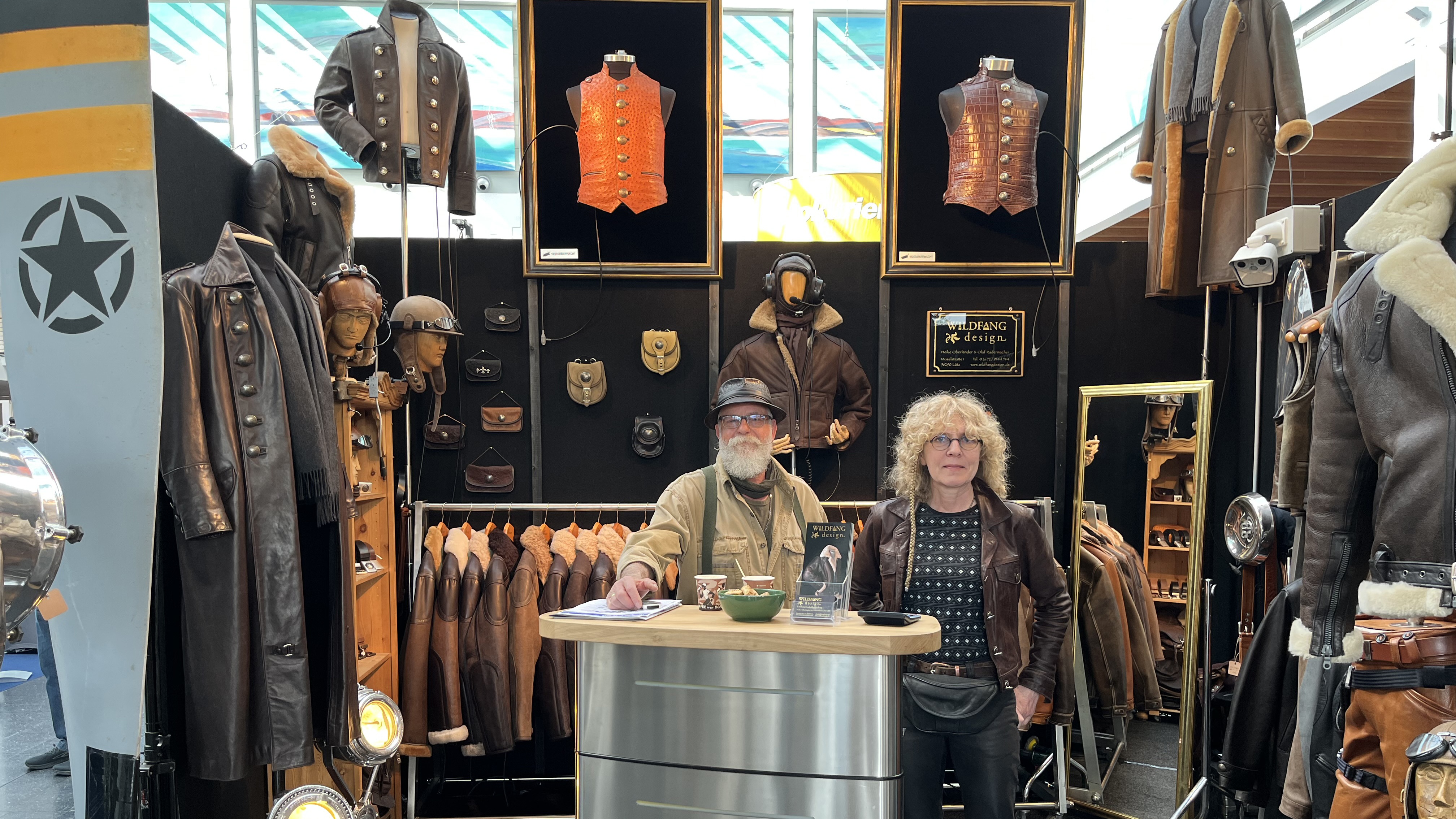 Retro leather garments: If you’re in the market for a superior quality, made-to-measure, durable aviation-themed coat, vest, flight jacket, helmet, or—yes, an ejection seat—with a distinct retro look and made of leather, Wildfang Design is your place. Pictured are Heike Oberländer and Olaf Radermacher at their booth at Aero Friedrichshafen. Supercool. (www.wildfangdesign.de). Photo by Sylvia Horne. 