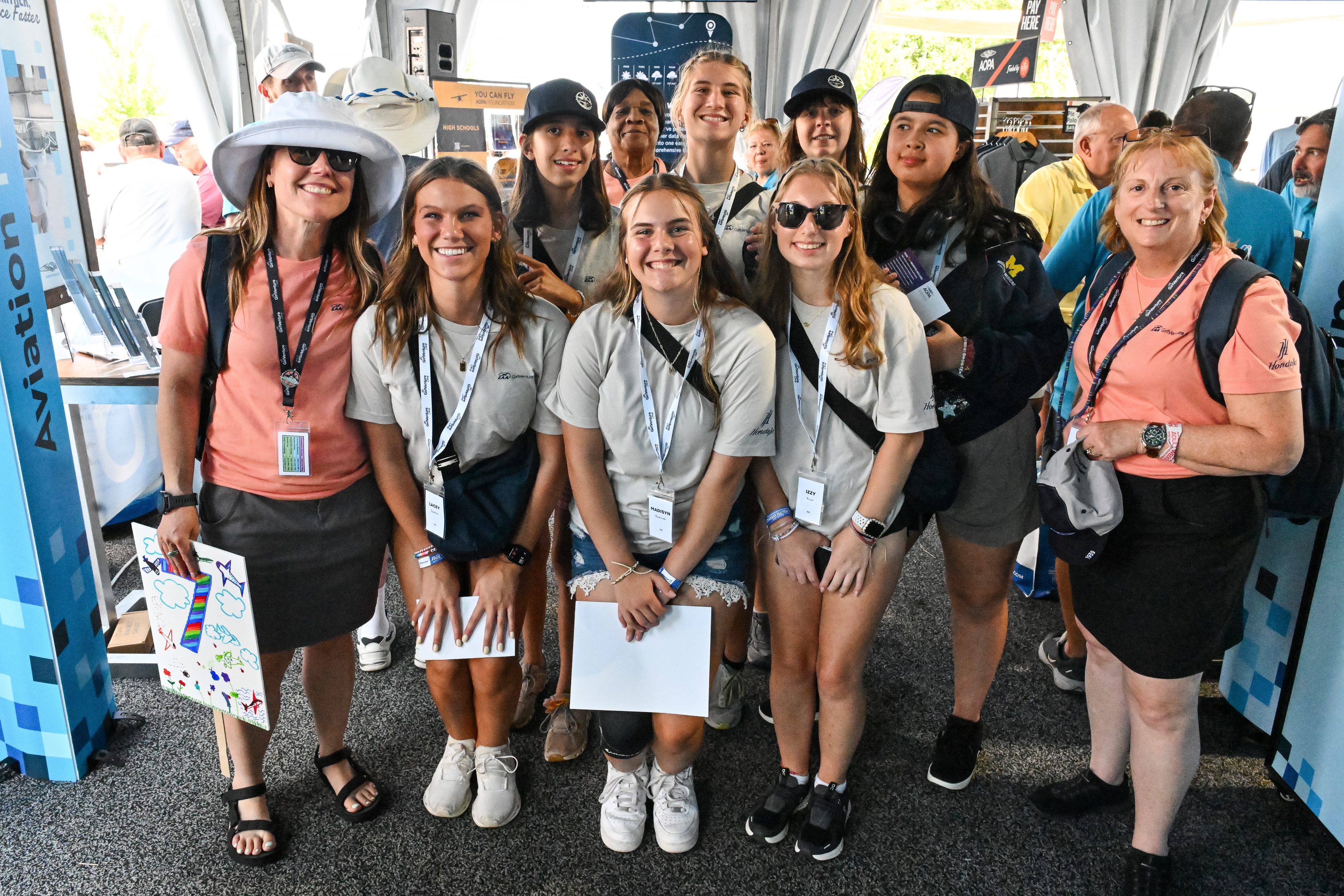 EAA GirlVenture Camp participants with mentor and Air Race Classic competitor Lin Caywood, right, stop at the AOPA campus. The three-day aviation-centered camp is designed to “engage, inspire, and educate young women to pursue their dreams in aviation and beyond,” according to the EAA website. Photo by David Tulis.