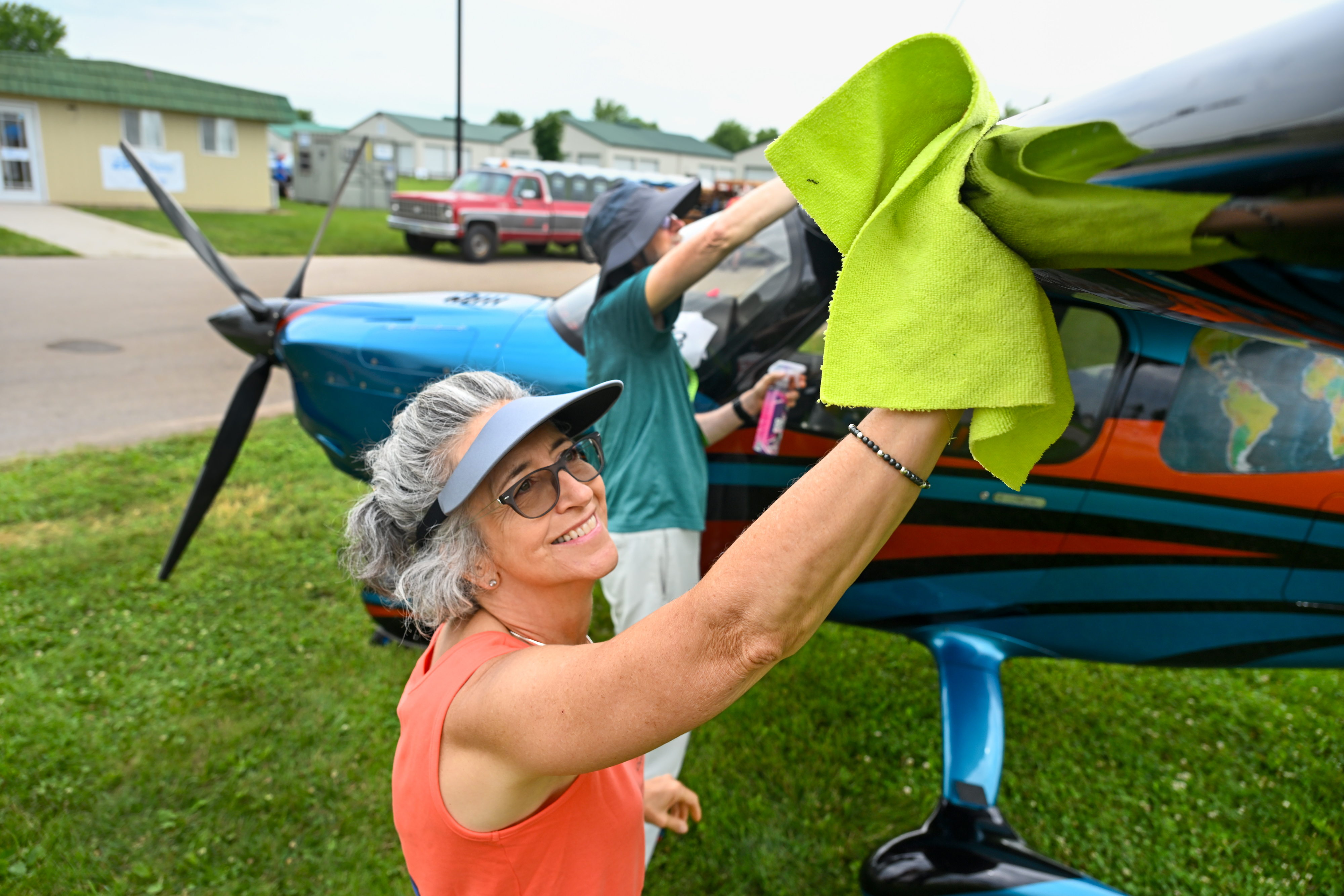 Linda Langenfield Sollars and her husband, Gordon, polish their Sling High Wing, an aircraft she built and flew from South Africa to the United States in 2022. Photo by David Tulis.