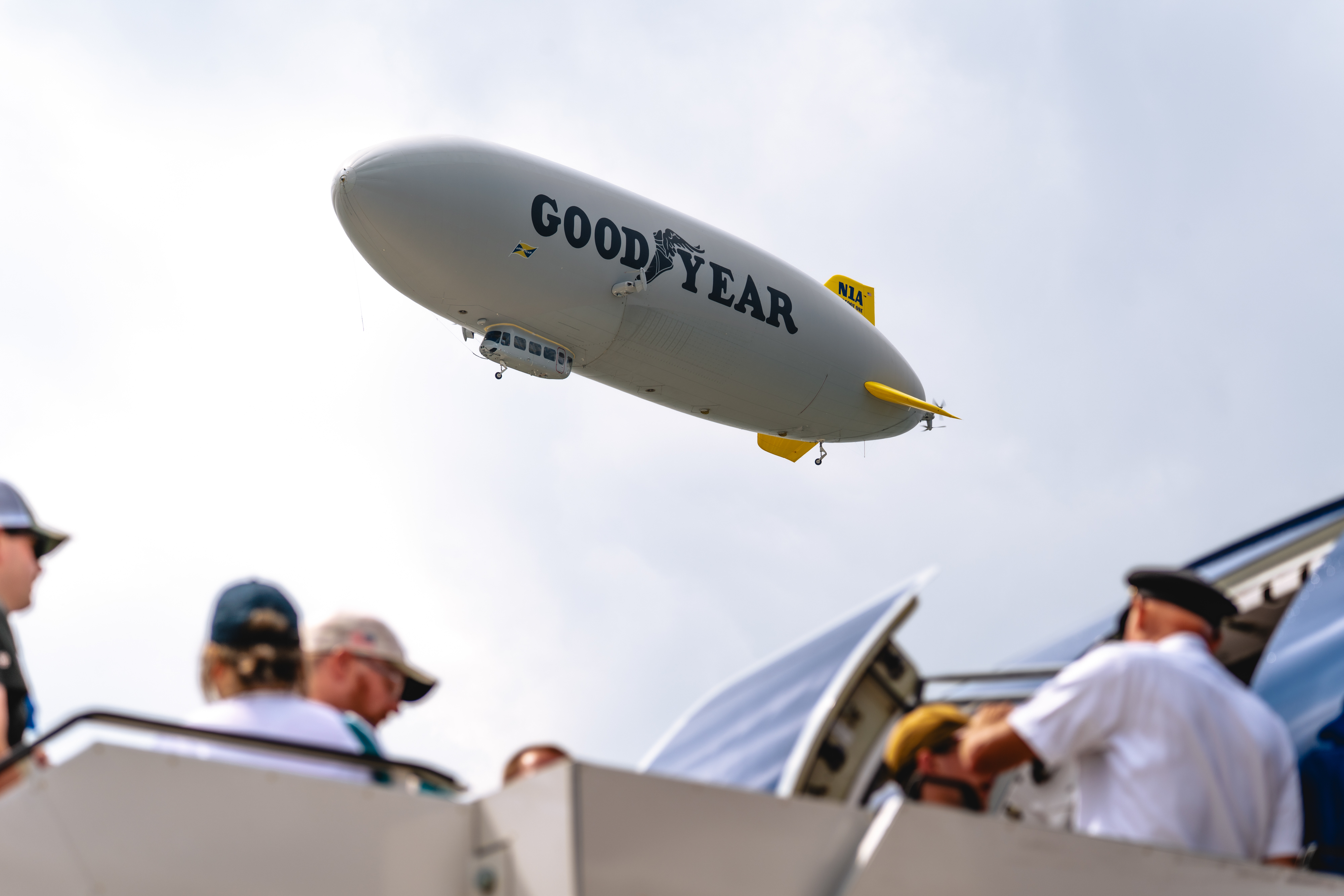 A Goodyear blimp flies overhead. Photo by Jake Teague.
