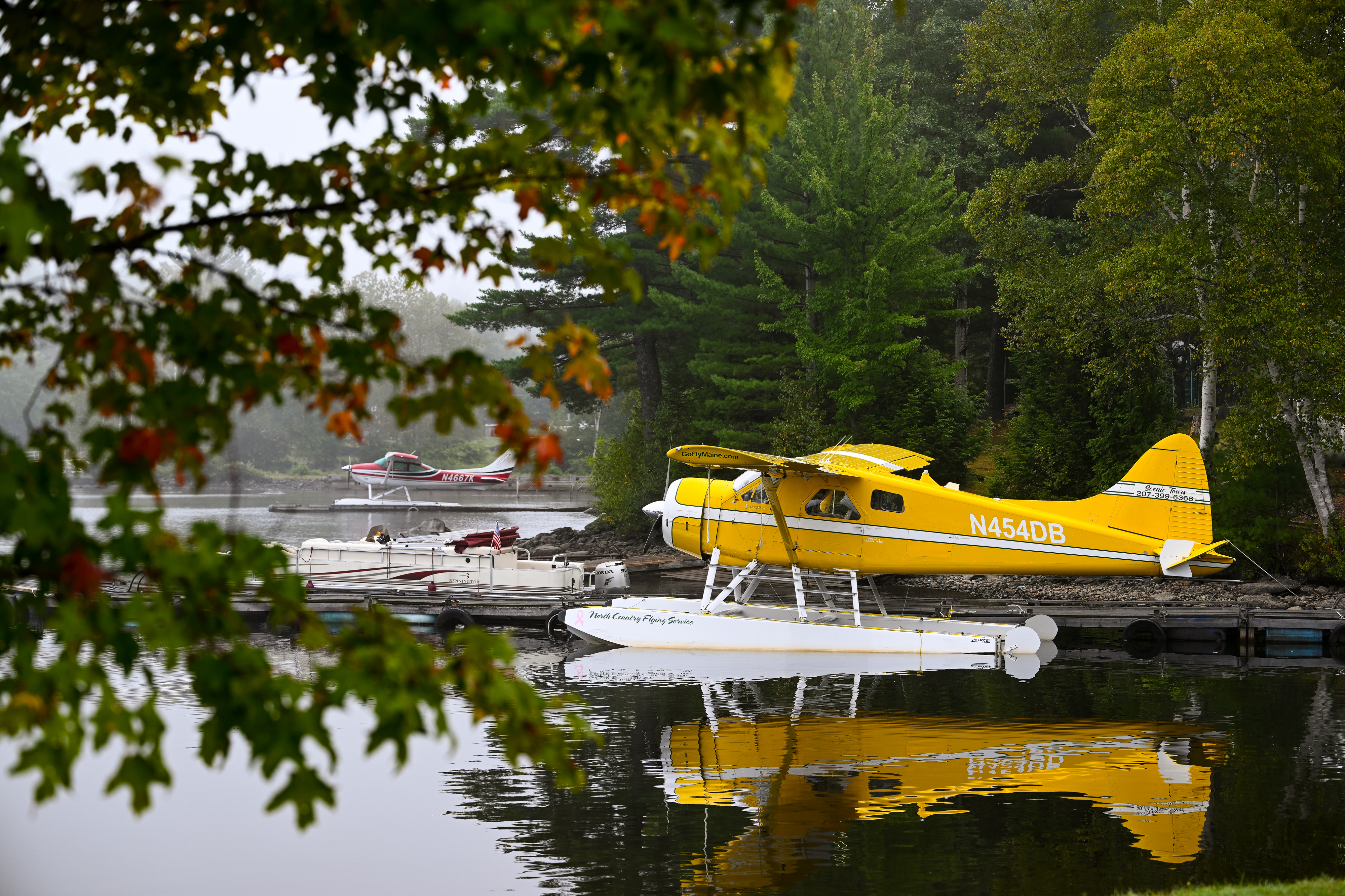 Morning mist surrounds a de Havilland DHC-2 Beaver and a Cessna 182 on floats at Moosehead Lake. Photo by David Tulis.