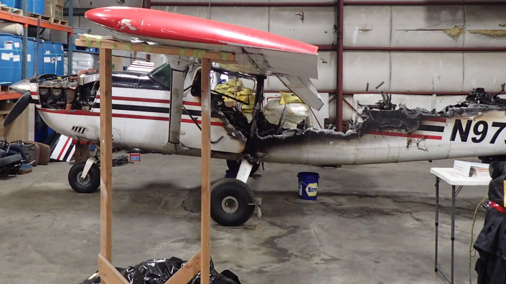 The pilot of this Cessna 207 on a charter flight out of Bethel, Alaska, smelled smoke soon after departure, and landed back at the airport. The pilot and five passengers escaped to safety moments before the aircraft was engulfed in flames. The fire was started by an improperly installed wire harness. NTSB photo.