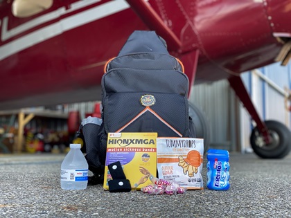 Gather candy, gum, water, and elastic pressure point bands to carry in your flight bag and share with passengers who might get motion sick. Photo by Alyssa J. Cobb.