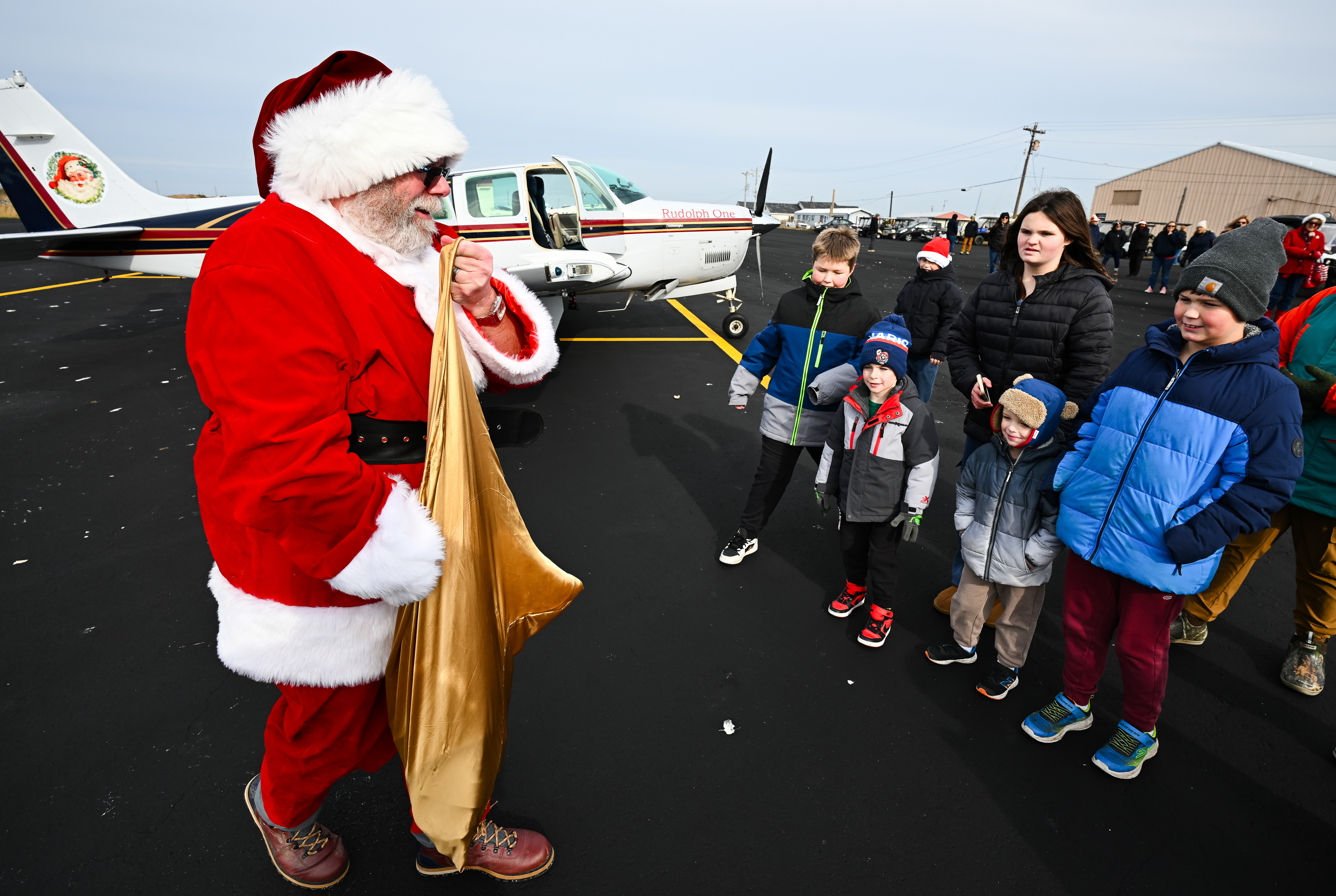 Children greet Santa Claus on Tangier Island on December 13. Photo by David Tulis.