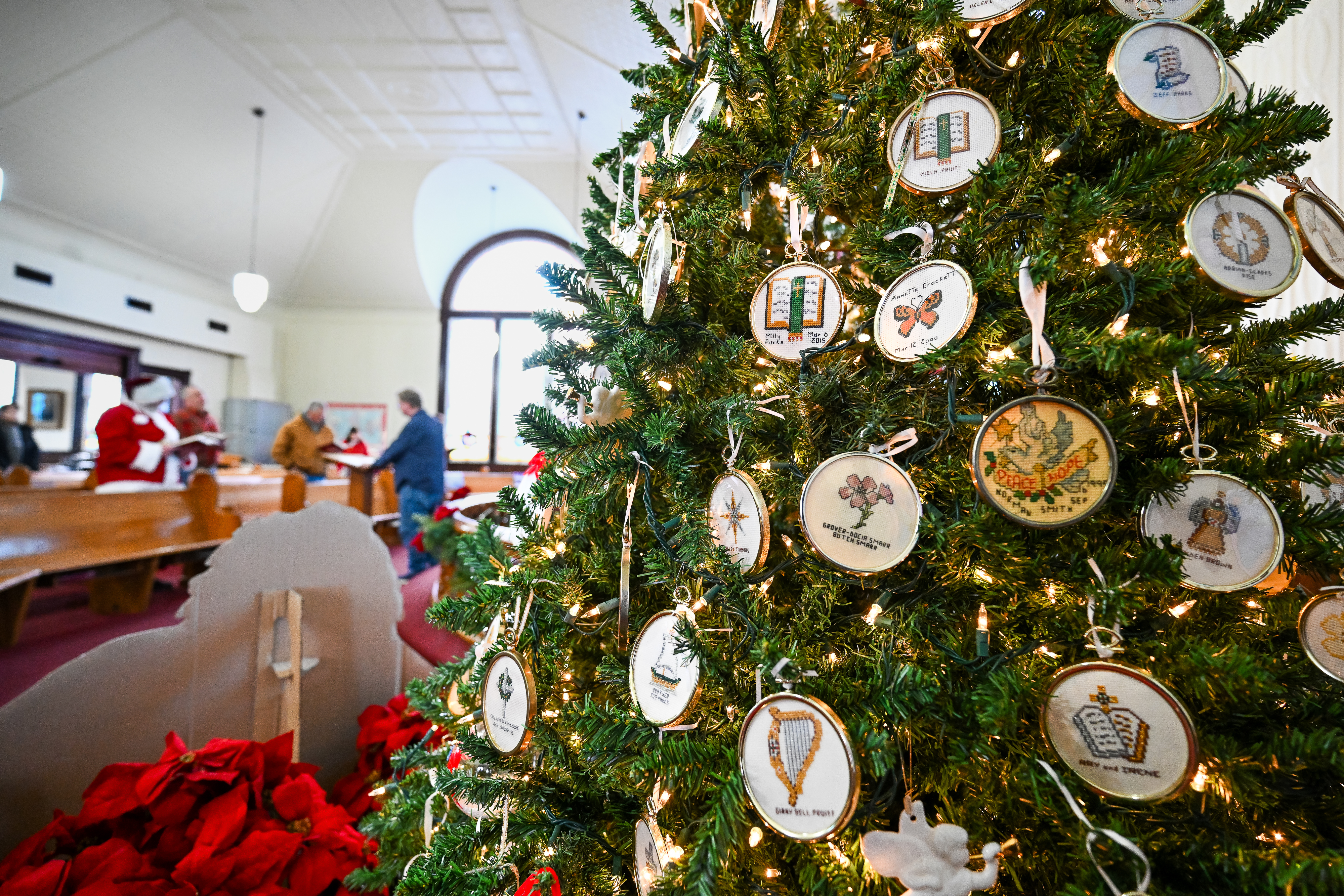Pilots, volunteers, and residents attend a holiday service at Swain Memorial Methodist Church on Tangier Island, Virginia, during the annual Tangier Holly Run. Photo by David Tulis.