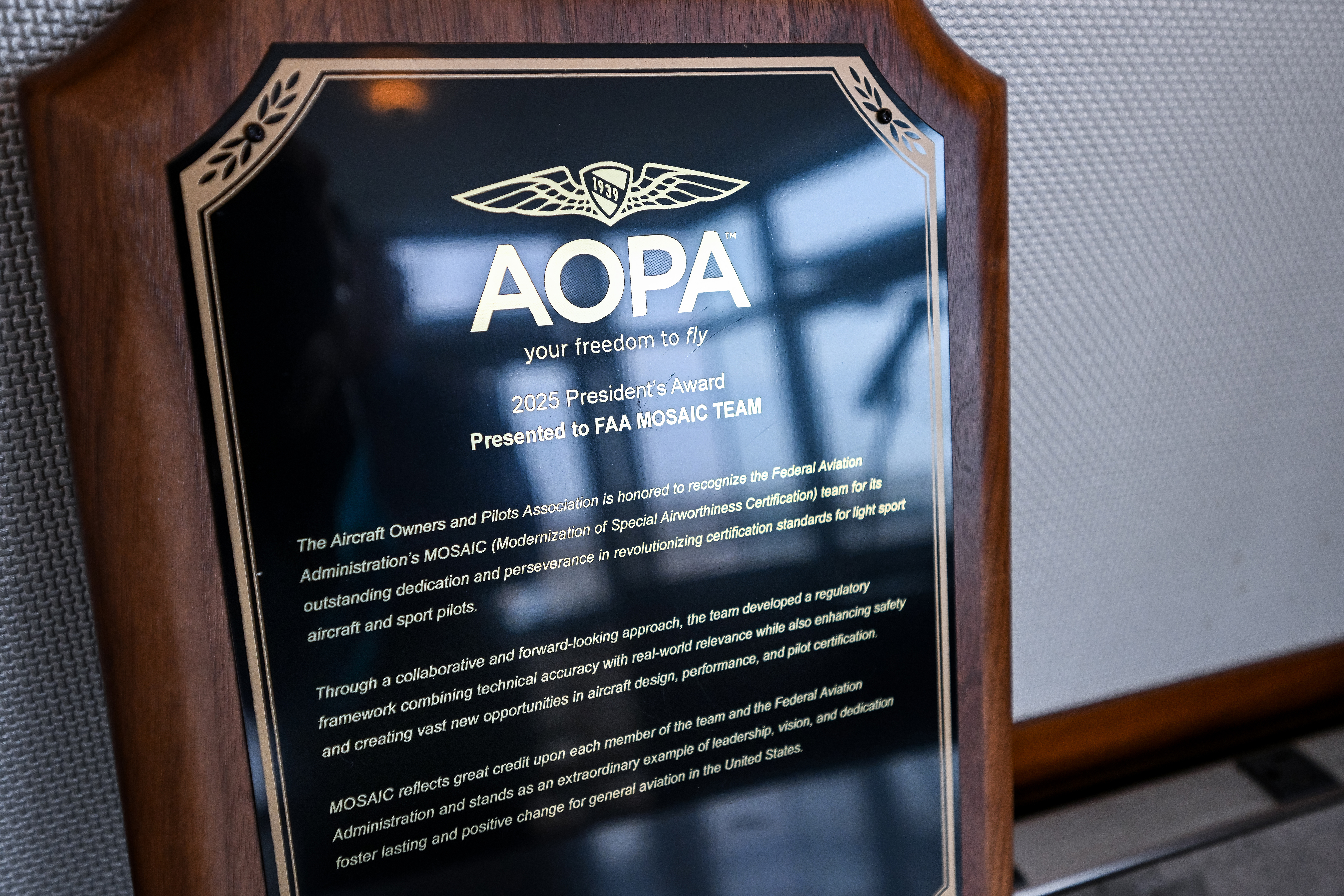 The AOPA President's Award presented to FAA Administrator Bryan Bedford describes collaboration on MOSAIC. Photo by David Tulis.
