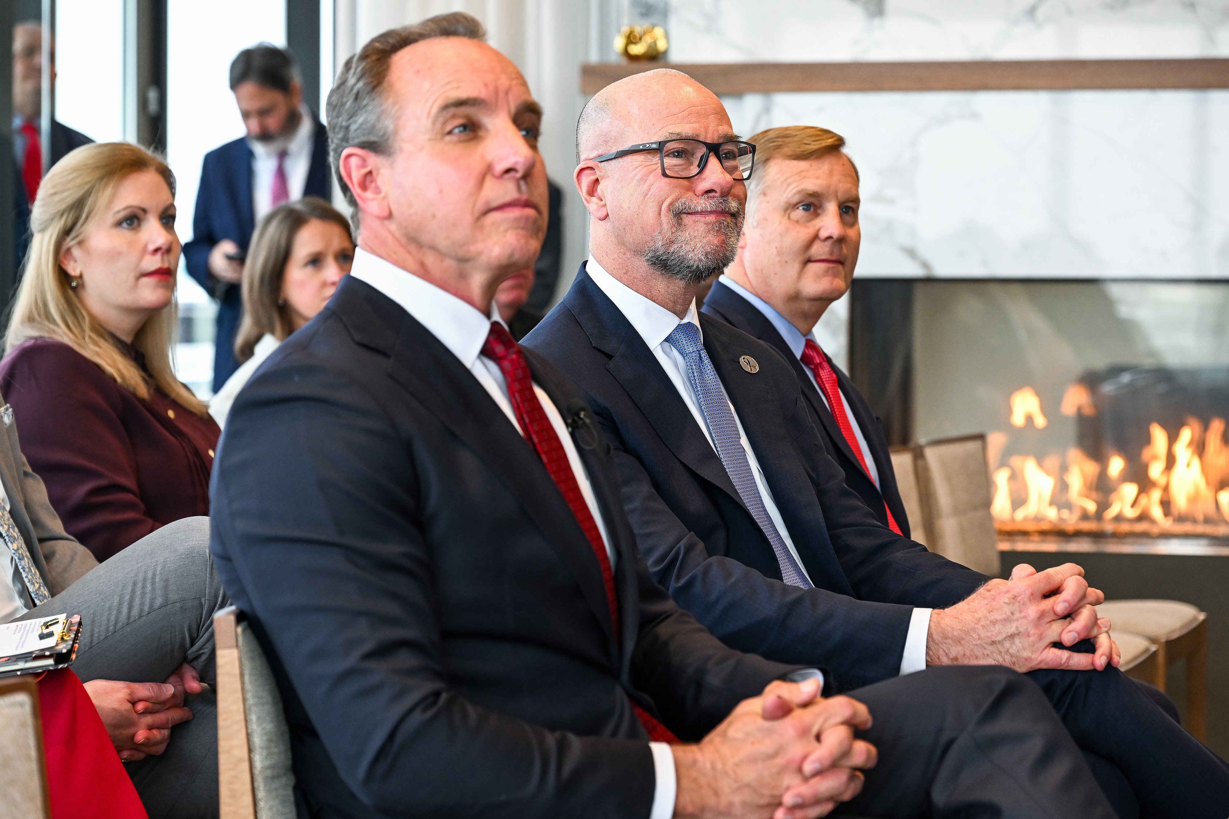 AOPA President Darren Pleasance joins FAA Administrator Bryan Bedford and Deputy Administrator Chris Rocheleau before presenting an AOPA President's Award to the FAA for collaboration on MOSAIC. Photo by David Tulis.