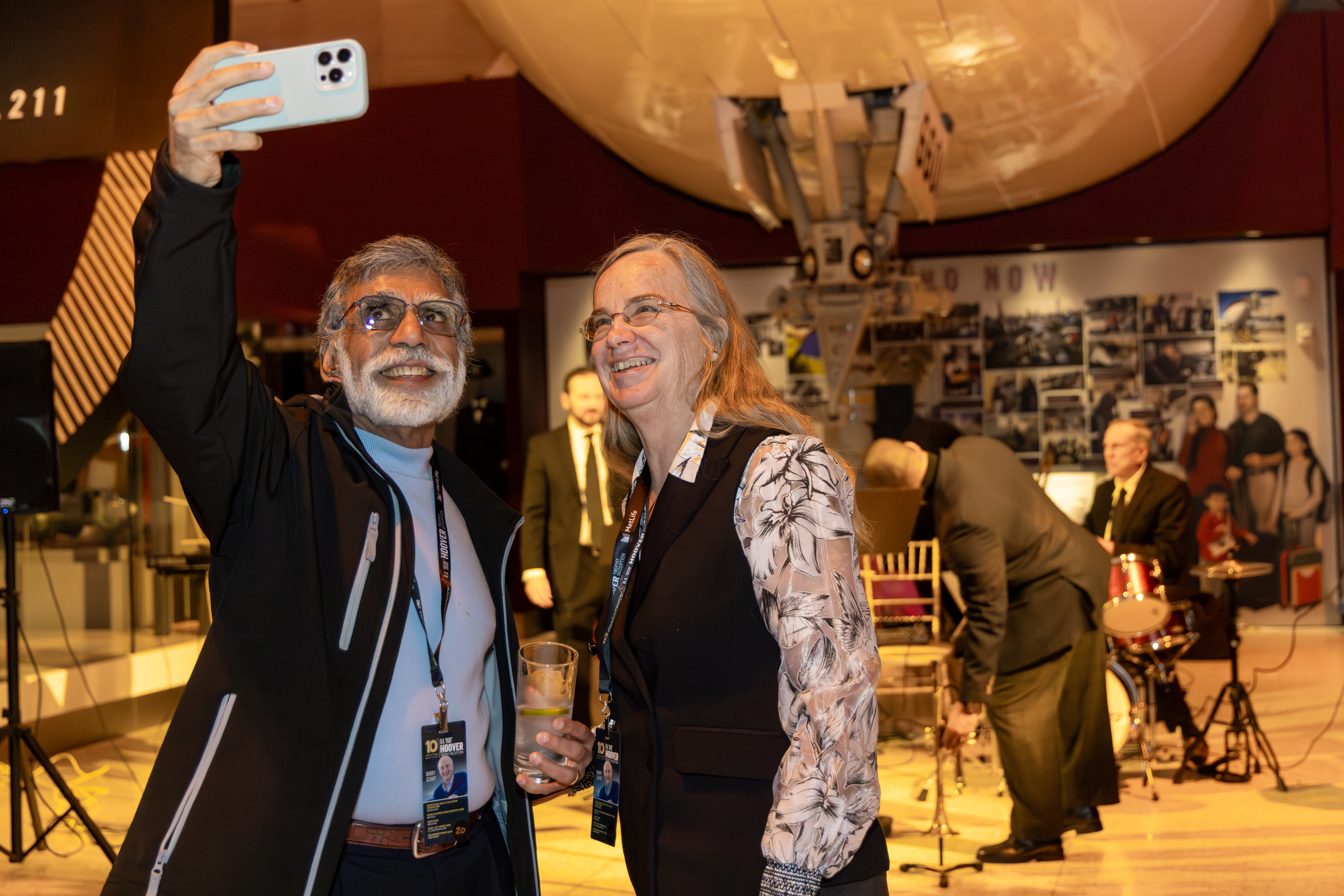 Attendees smiled for a selfie in front of the museum exhibits. Photo by Rebecca Boone.