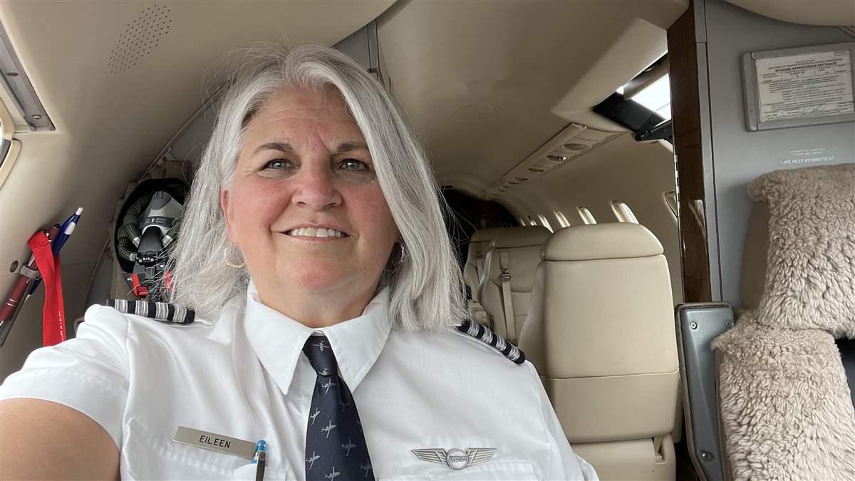 Retired Air Force pilot Eileen Isola sits in the right seat of the Challenger 605 after reclaiming her flying career.