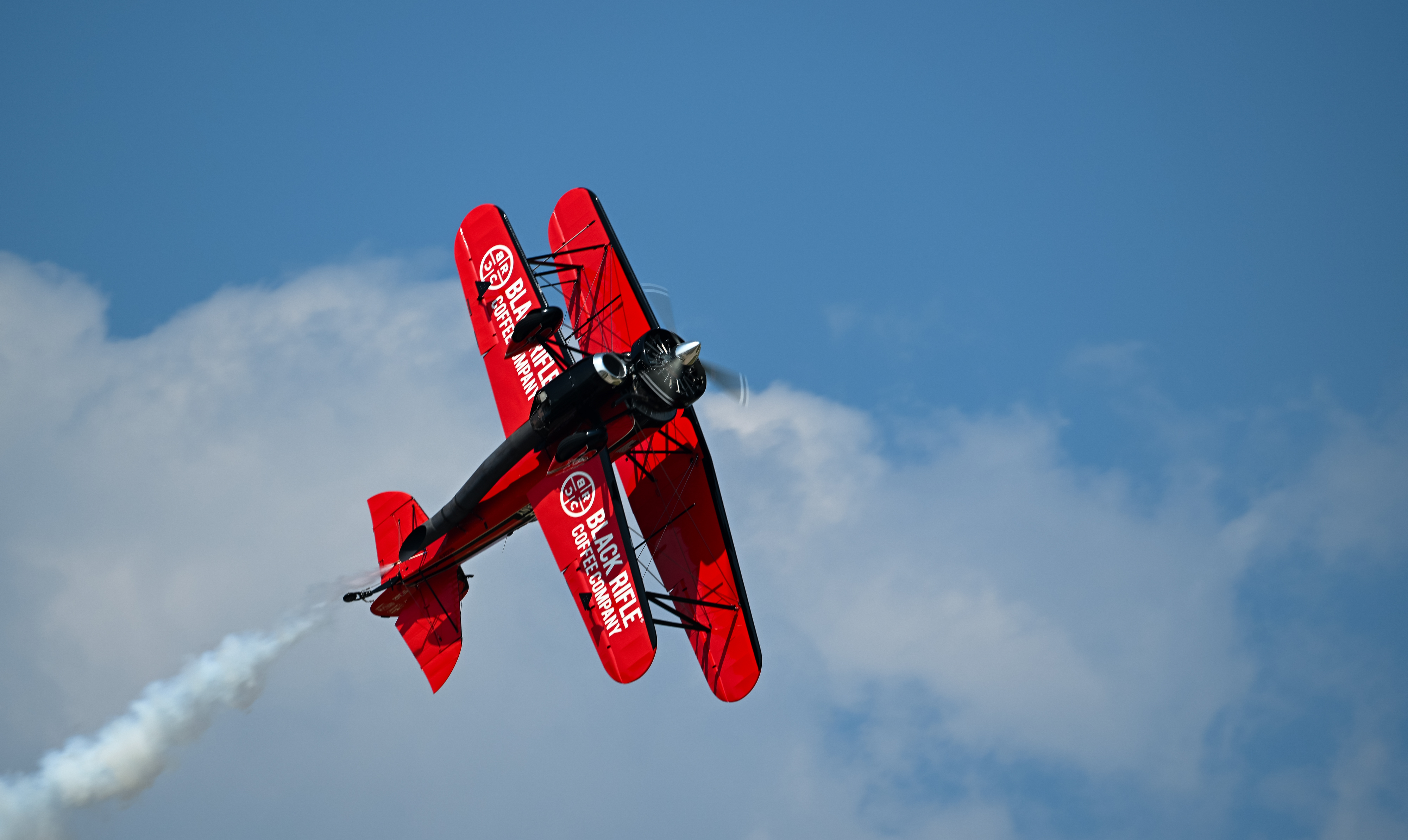 Jarrod Lindemann in a Jet Waco performs during the opening day airshow. Photo by David Tulis.
