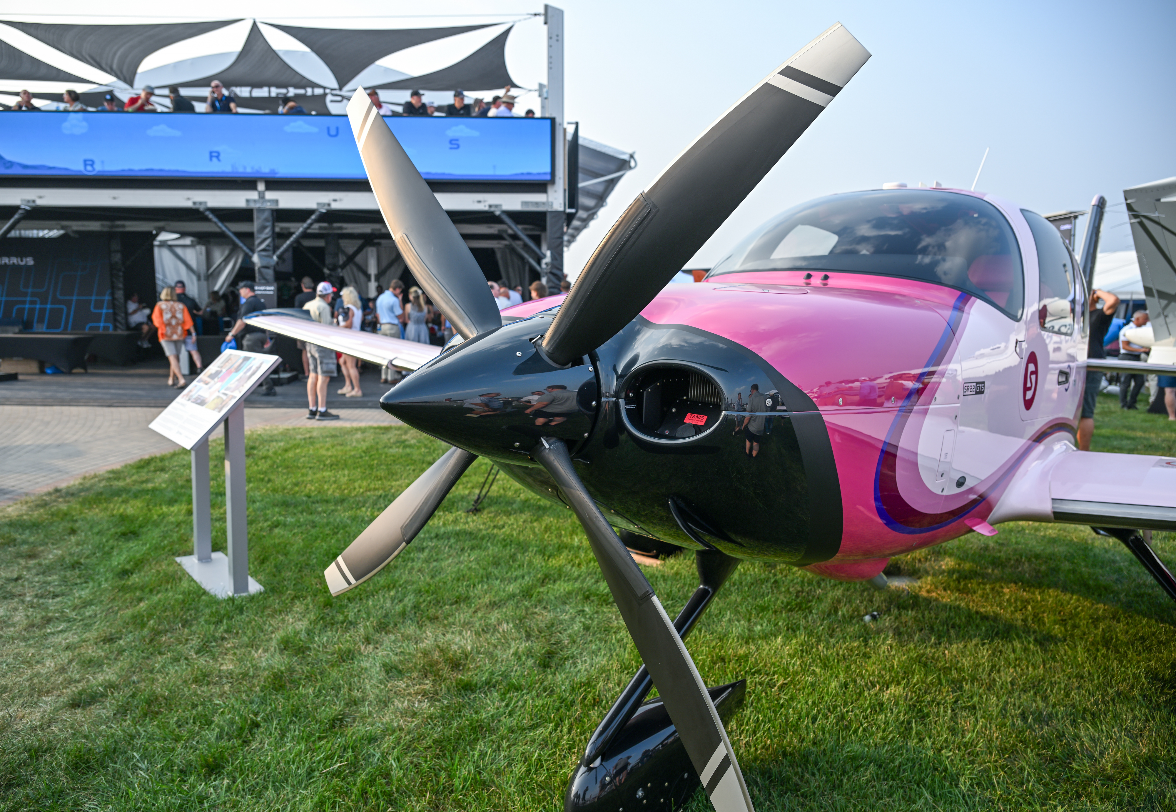 The pink Cirrus SR22 of content creator Sarah Daniels is displayed on the Cirrus campus. Photo by David Tulis.