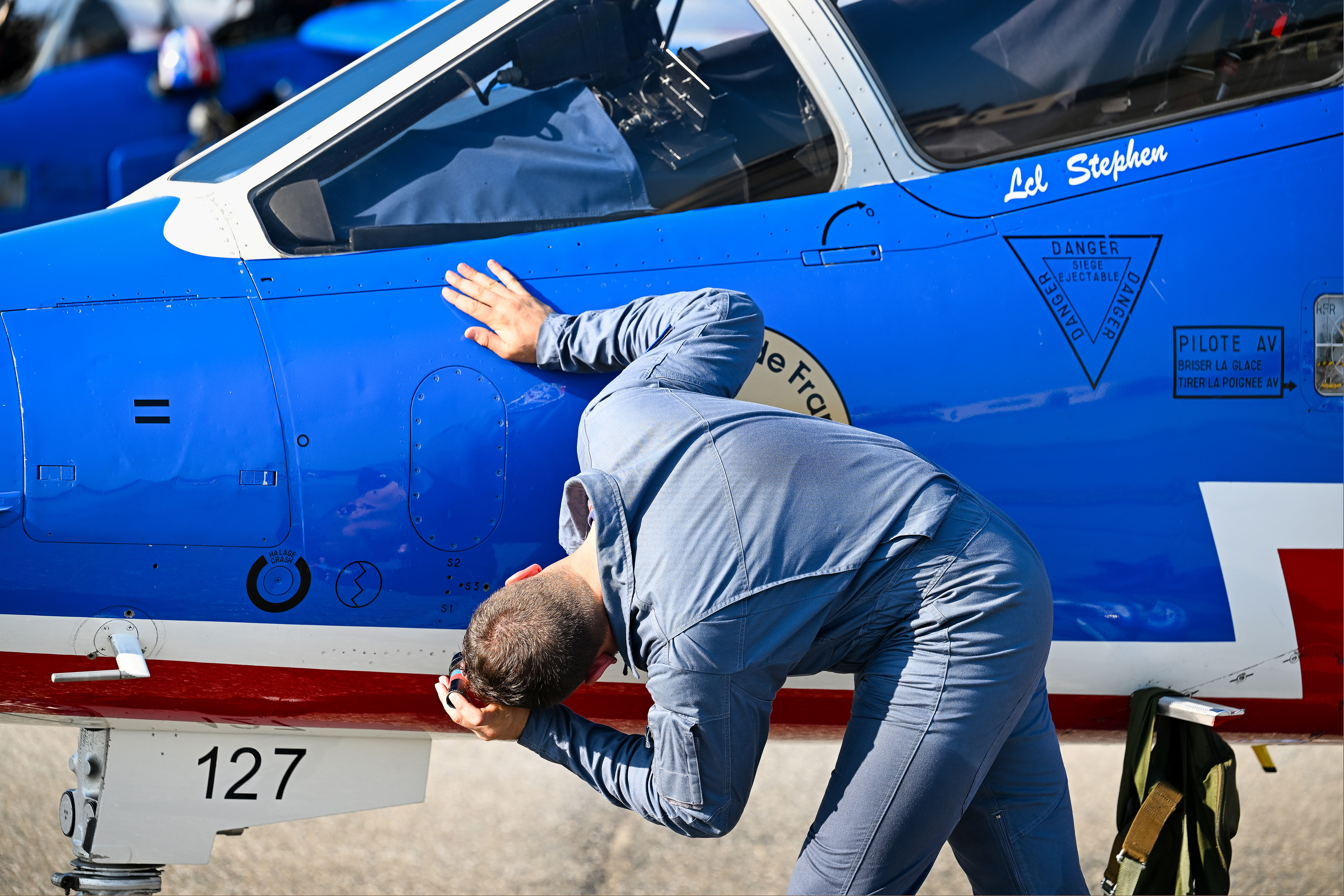 Patrouille de France team members perform a postflight inspection. Photo by David Tulis.