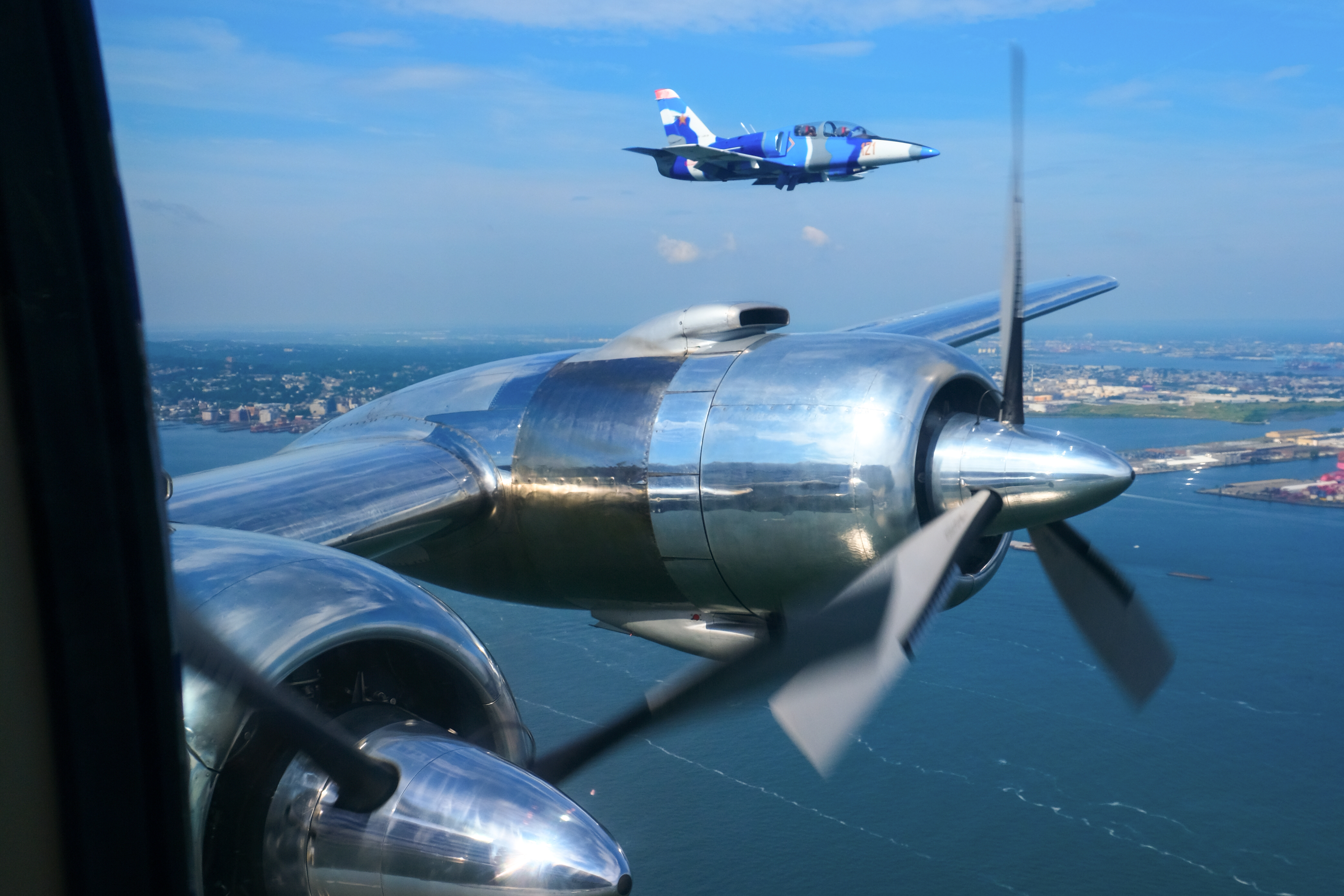Million Air’s Aero L–39 Albatros forms up with the DC–6 over the Hudson. Photo by Alicia Herron.