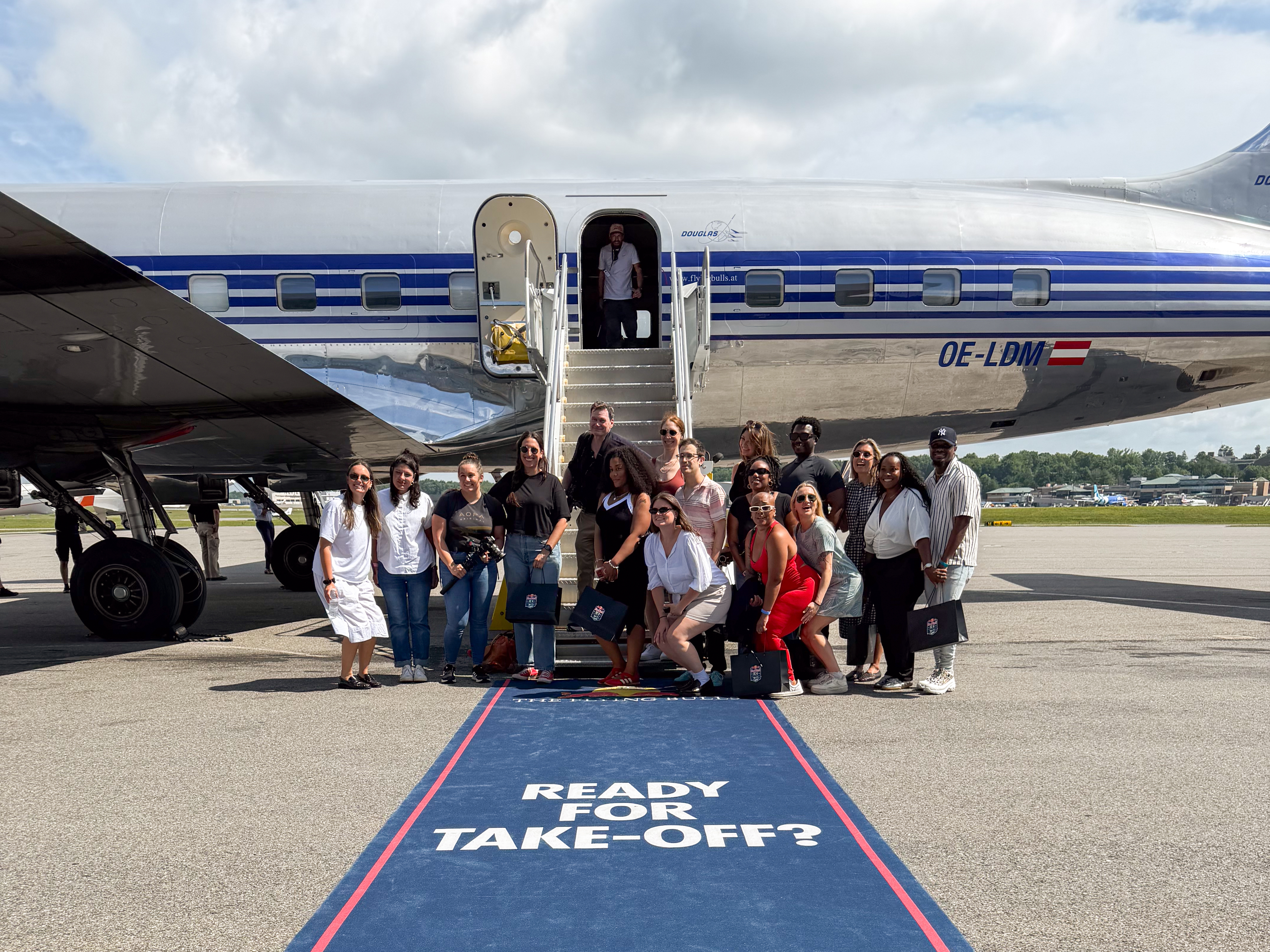 Postflight smiles on the blue carpet. Photo by Steph Stricklen.