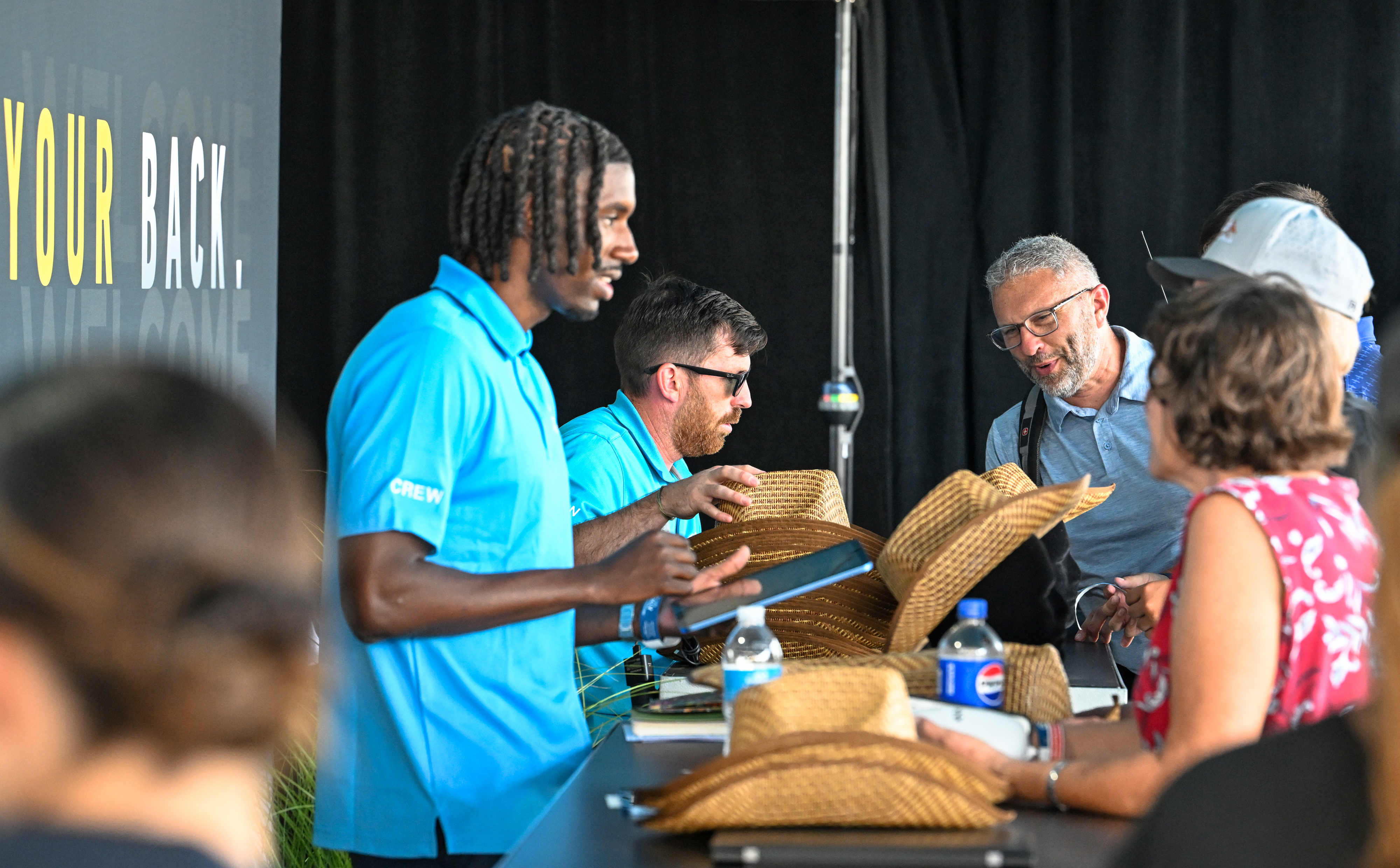 AOPA members receive a special straw hat at the show. Photo by David Tulis.