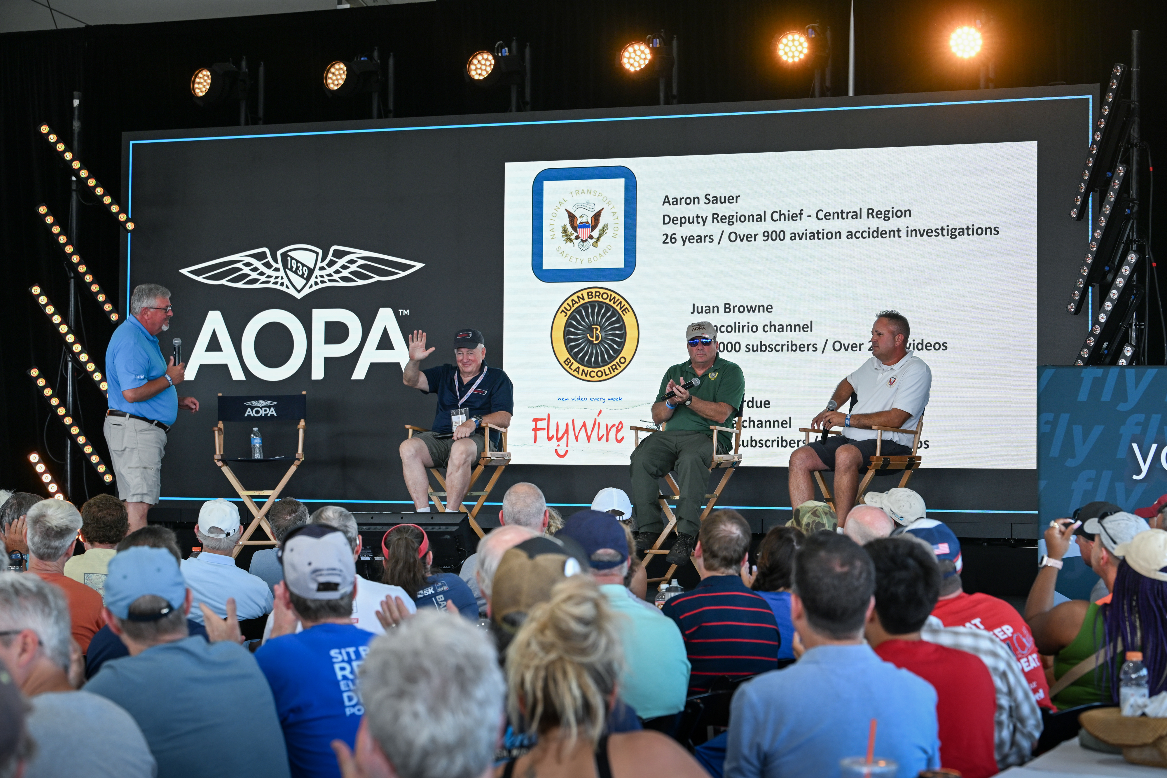 The AOPA Air Safety Institute’s Mike Ginter facilitates a standing-room-only 'After the Accident' seminar with safety experts Aaron Sauer, Juan Browne, and Scott Perdue. Photo by David Tulis.