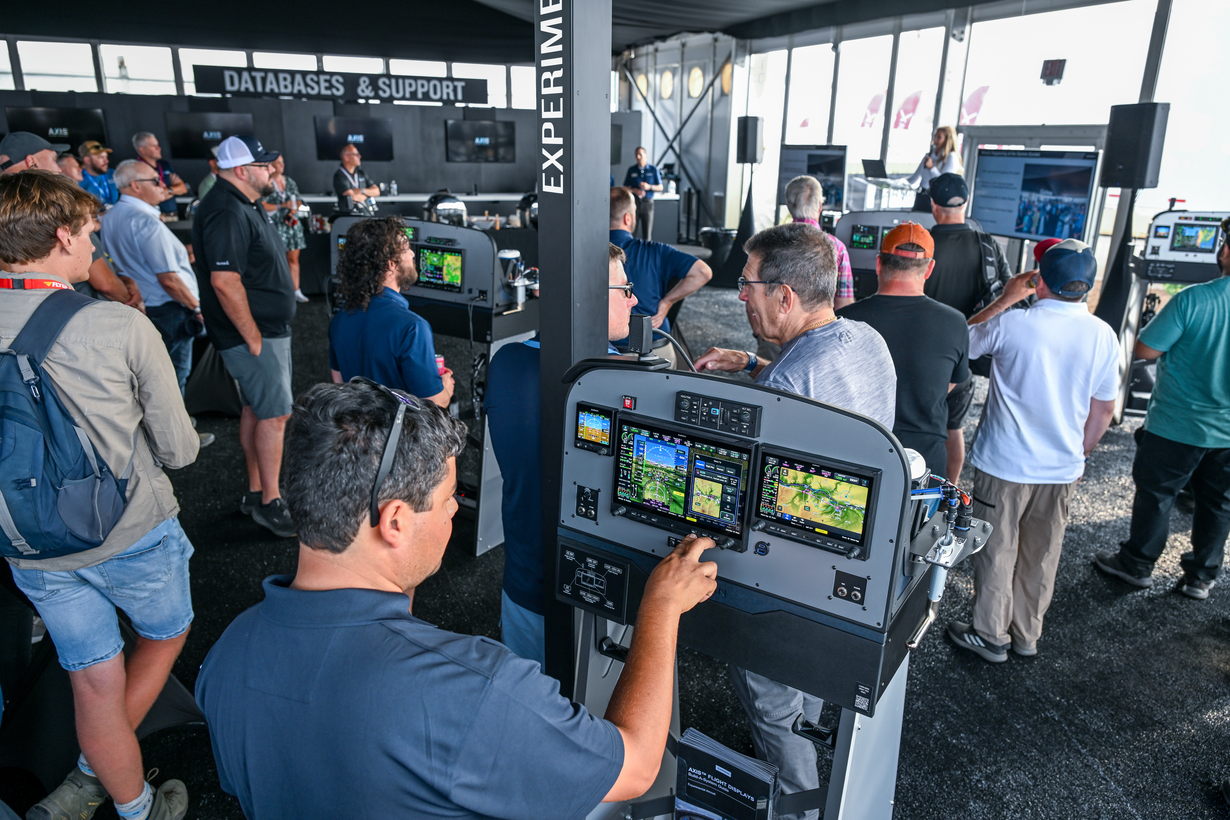 Garmin displays its new avionics system at a welcome party. Photo by David Tulis.