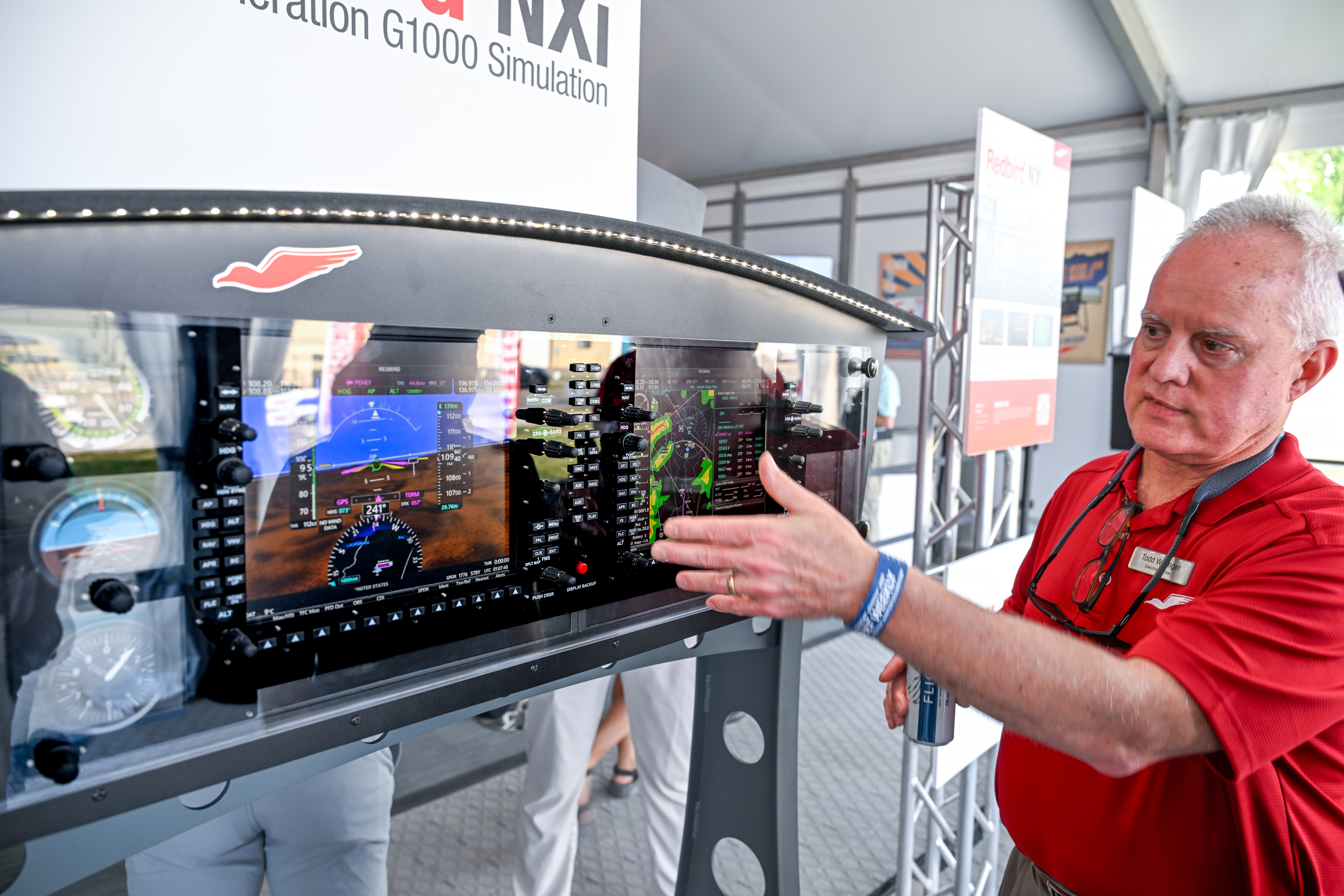 Redbird Flight Simulations’ Todd Willinger demonstrates a Garmin G1000 NXi device. Photo by David Tulis.