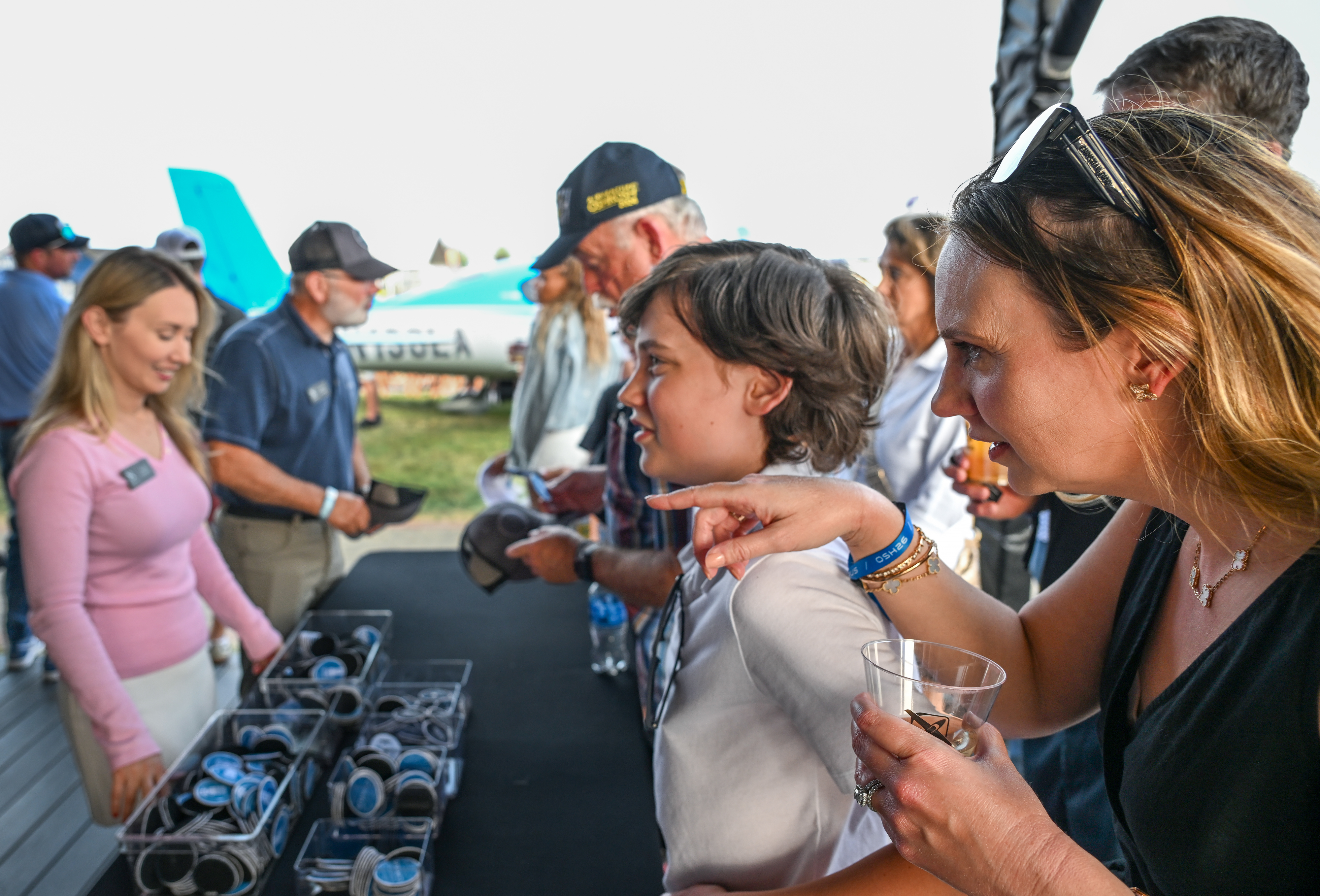 Attendees participate in the Cirrus Aircraft welcome party. Photo by David Tulis.