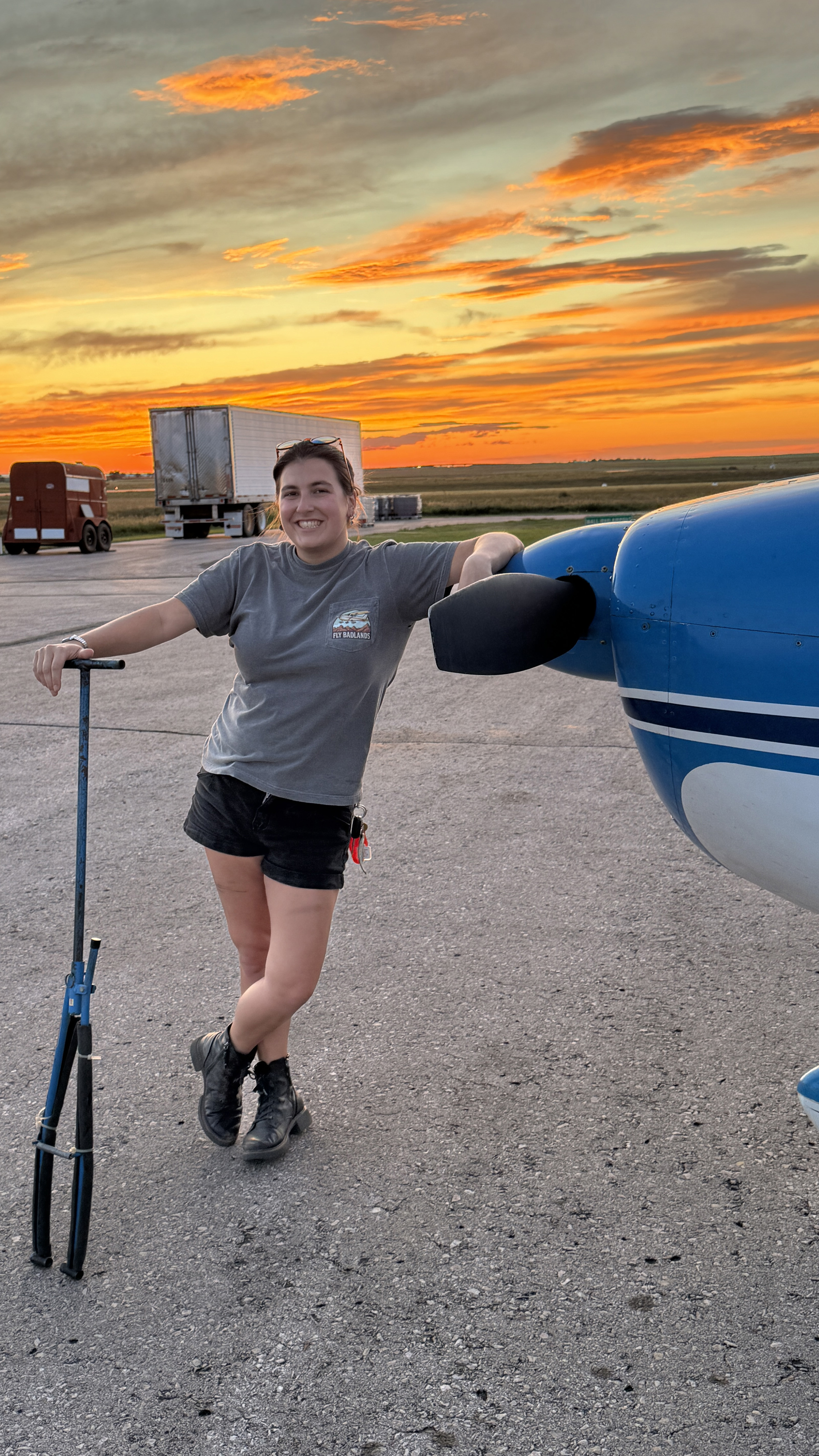 Komar leaning on her Cessna 182. Photo courtesy of Ana Komar. 