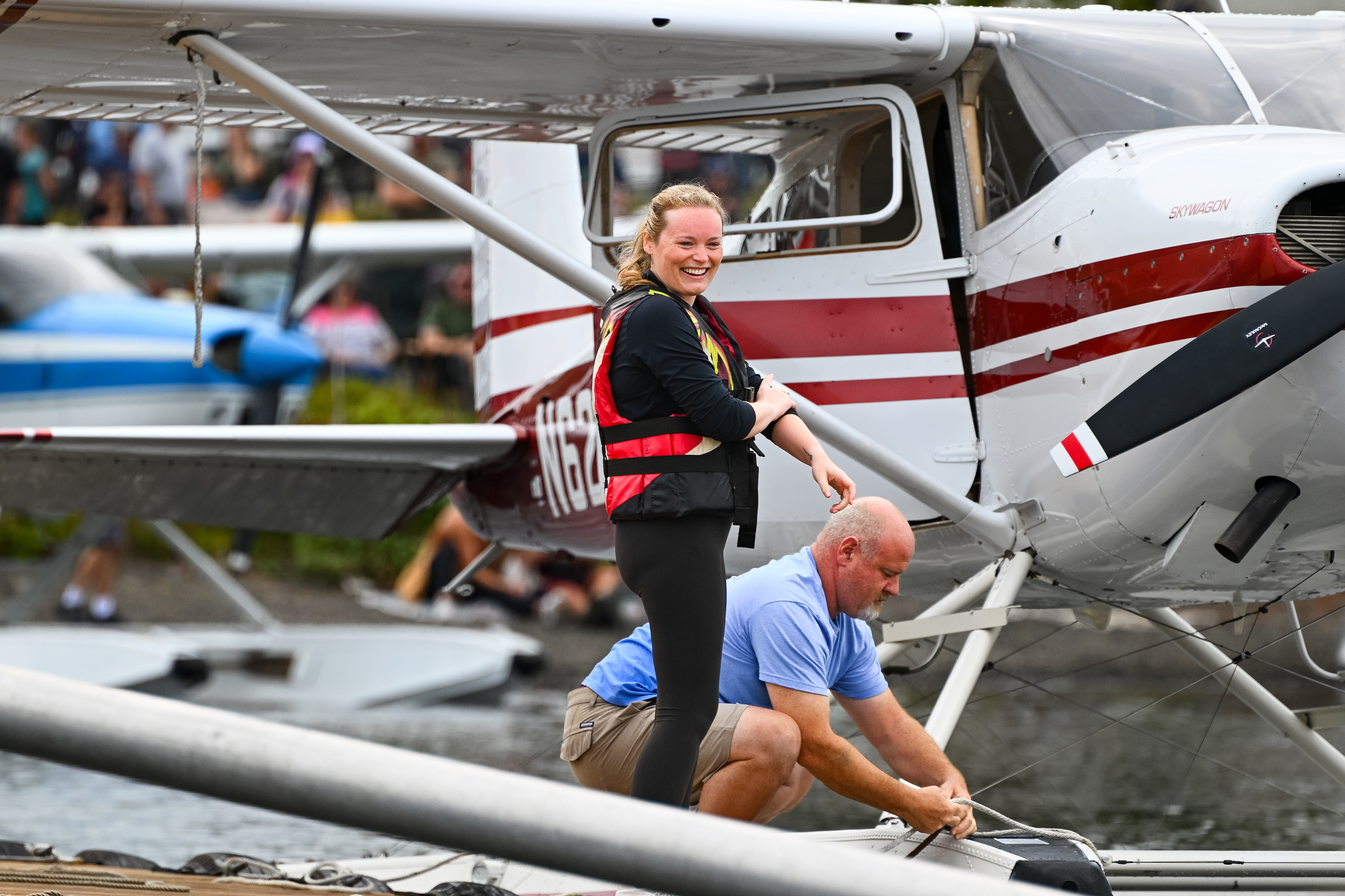 Baily Cust and her uncle, Jeff Hardy, with his 1969 Cessna 180, prepare for the contest. Photo by David Tulis.