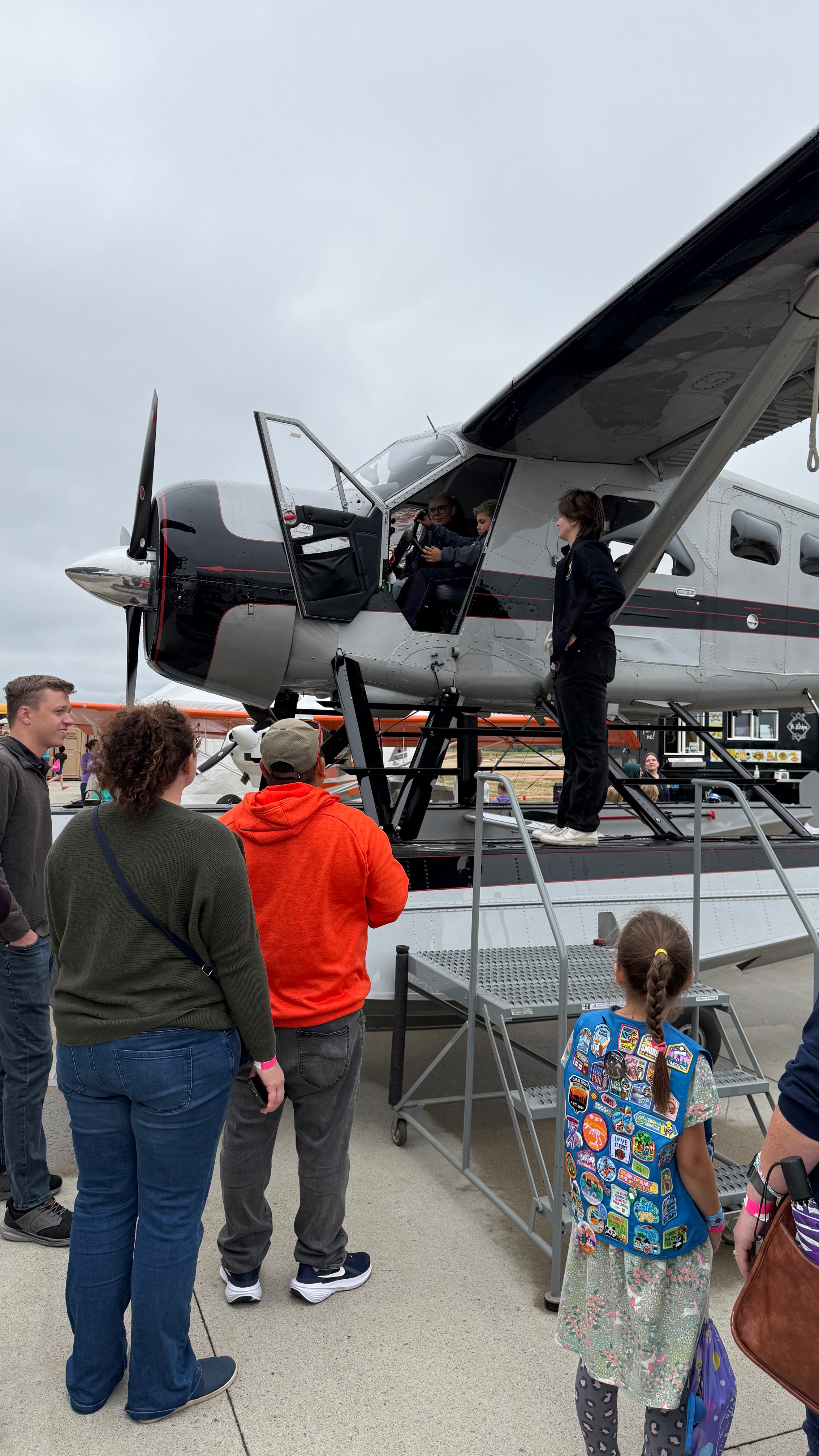 Visitors line up to sit in an aircraft on floats. Photo by Chris Rose. 