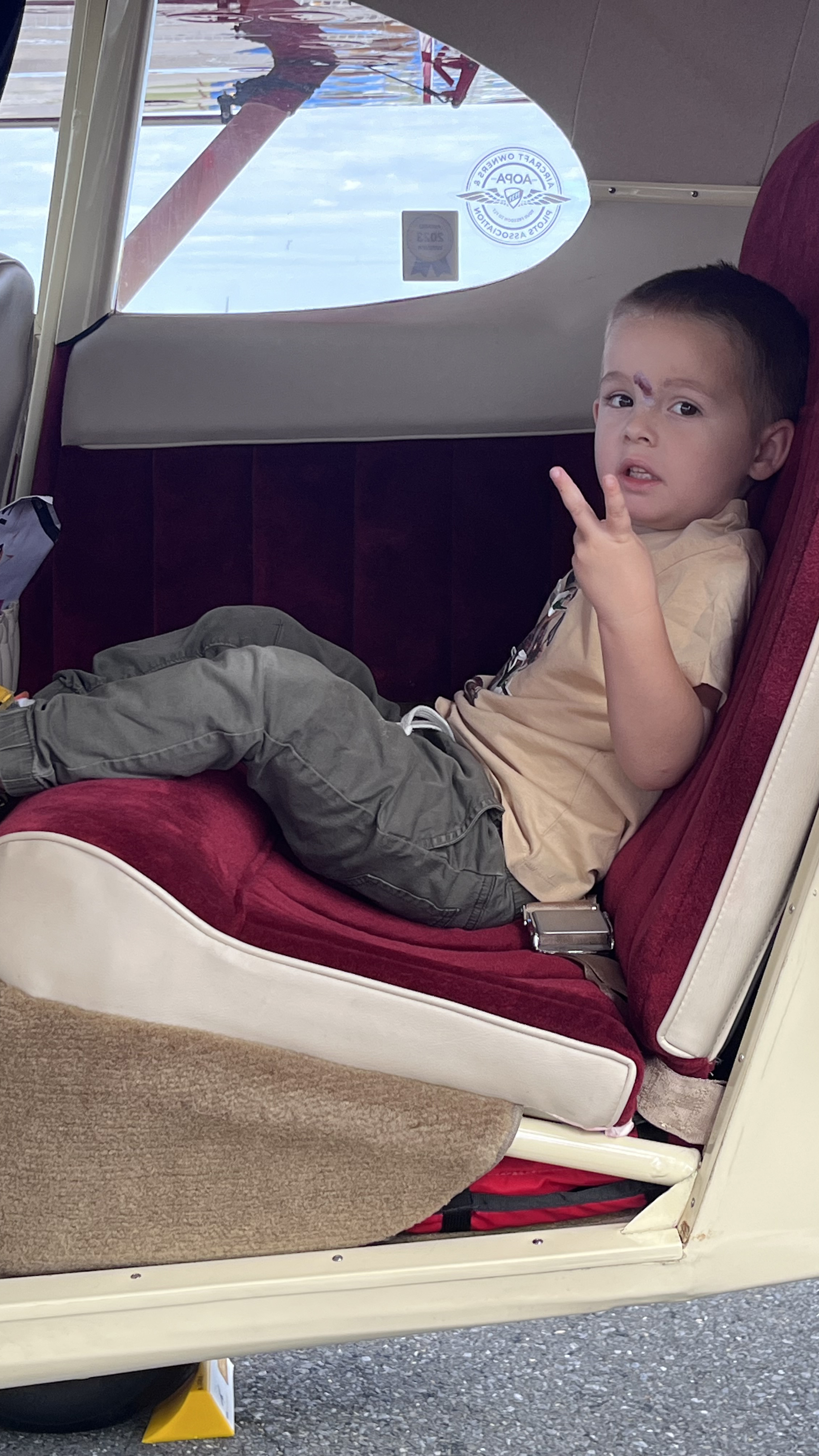 Silas sits happily in a Piper Tri-Pacer on the static display. Photo by Sylvia Horne. 