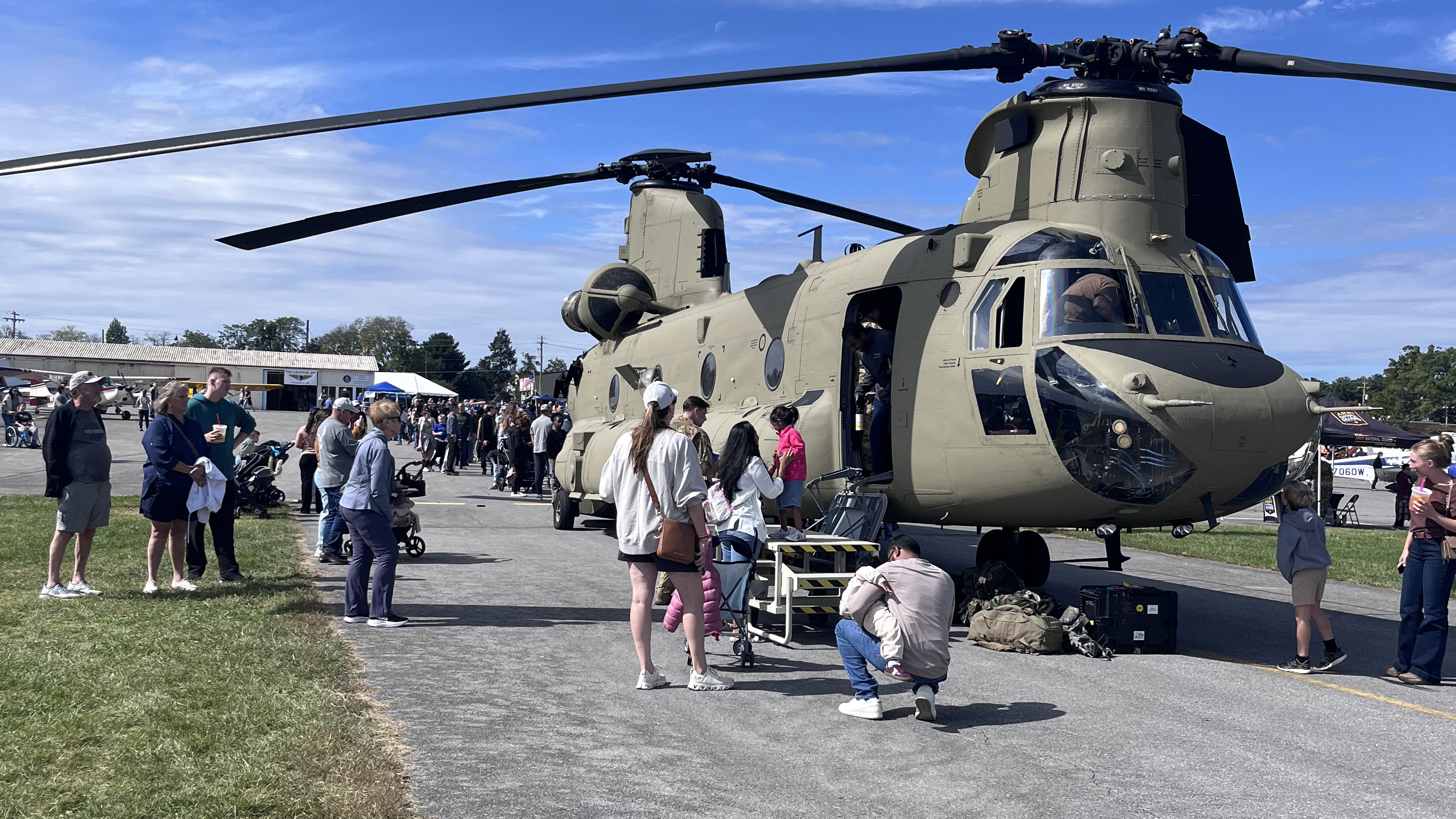 Attendees queue to get inside the Chinook. Photo by Sylvia Horne. 