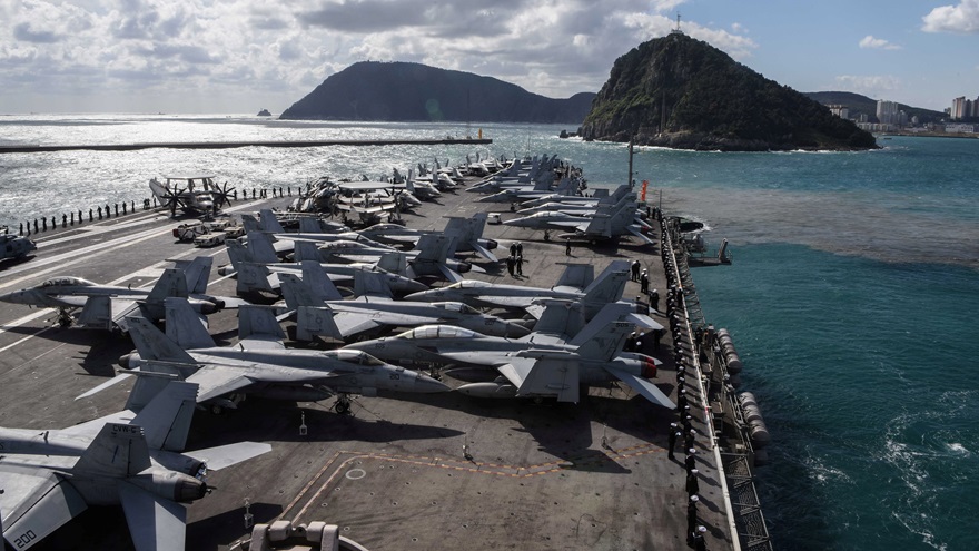 The aircraft carrier USS Ronald Reagan maneuvers along the waters east of the Korean Peninsula prior to a scheduled port visit in Busan, Republic of Korea in this Oct. 21, 2017 handout photo. Photo by Mass Communication Specialist 3rd Class MacAdam Kane Weissman/U.S. Navy via REUTERS.