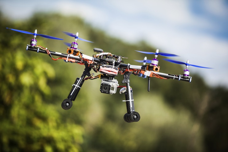 A carbon-fiber drone with GPS tracking lifts off. iStock photo.