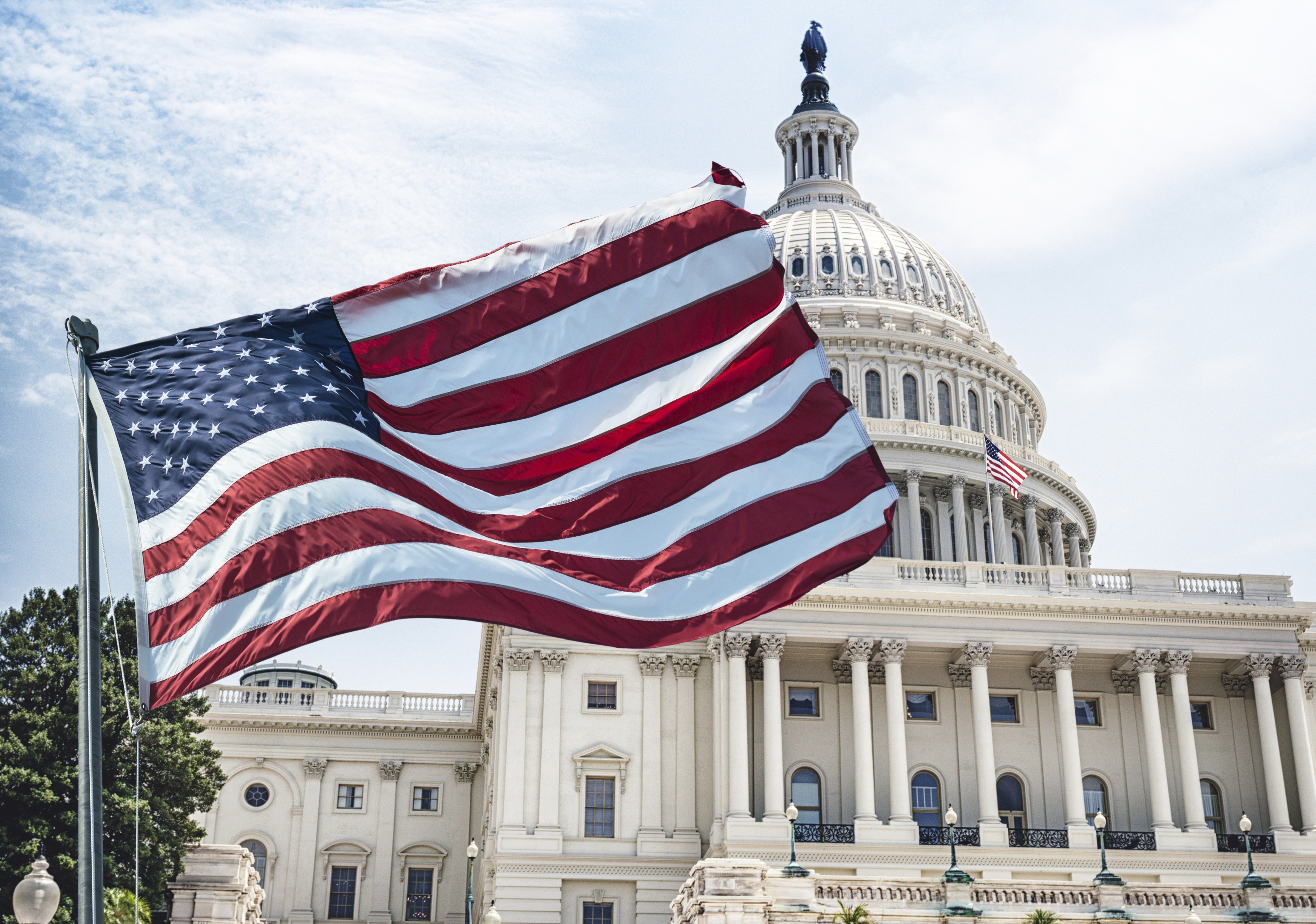 An American flag waves during a national holiday in Washington, D.C. iStock photo.