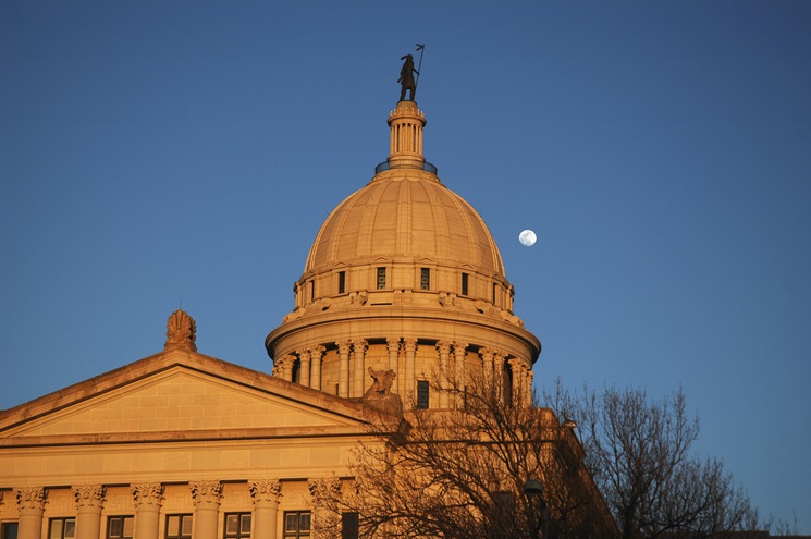 The moon rises over the Oklahoma State Capital. iStock photo.                                                        