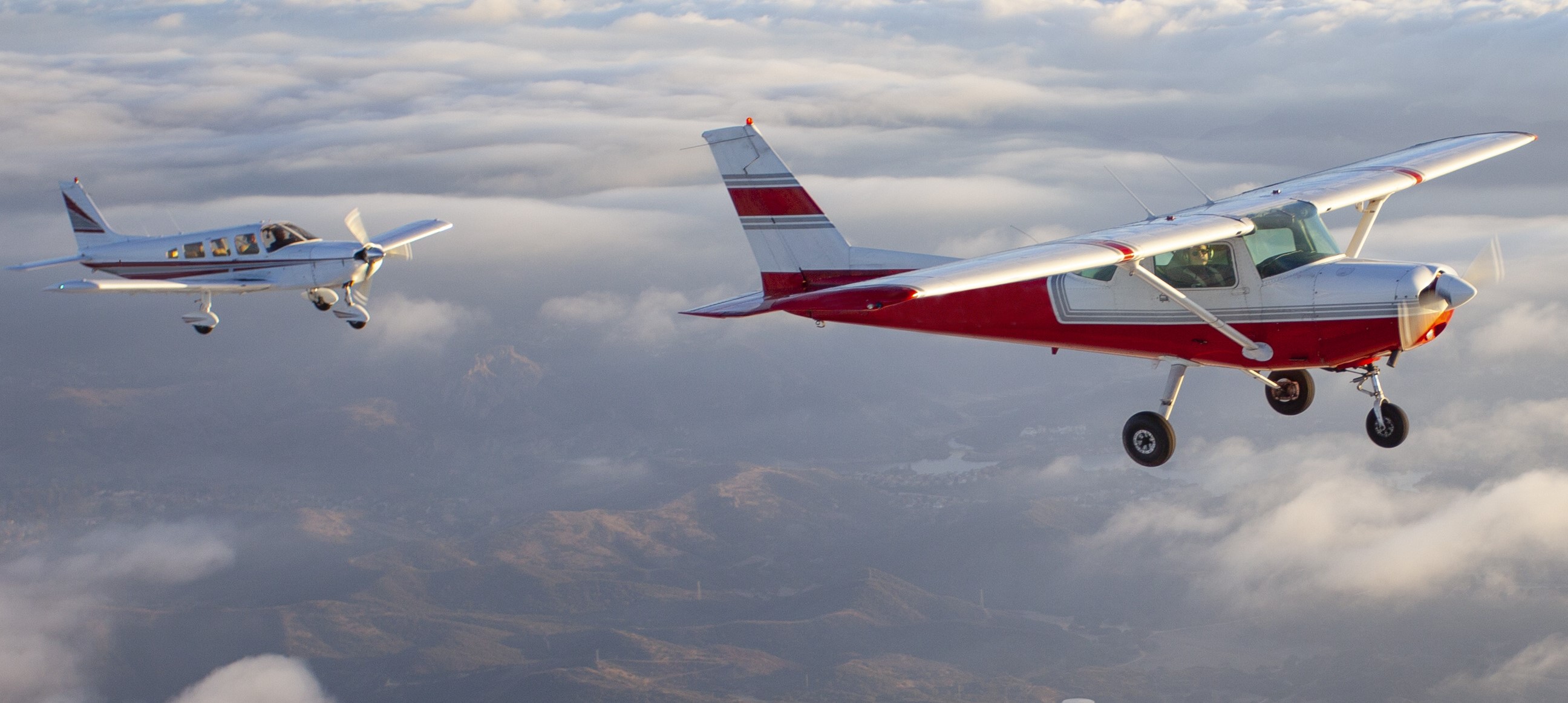 Popular single-engine airplane flying through the clouds