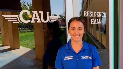 Olga working as a Residence Assistant at CAU's on-campus residence hall.