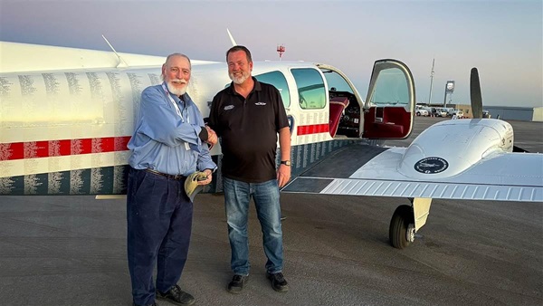 GAMI co-founder George Braly and CAU President Matt Johnston celebrate the University's flight with G100UL at the Buckeye Air Far.