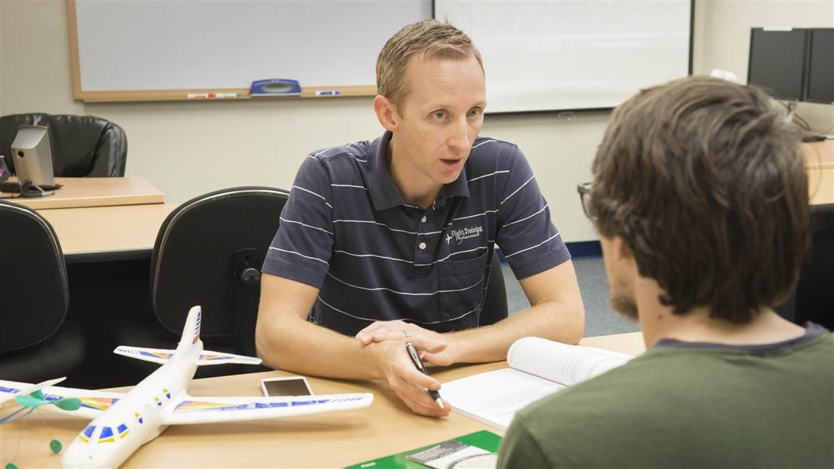 Evan Pickle coaches a student.