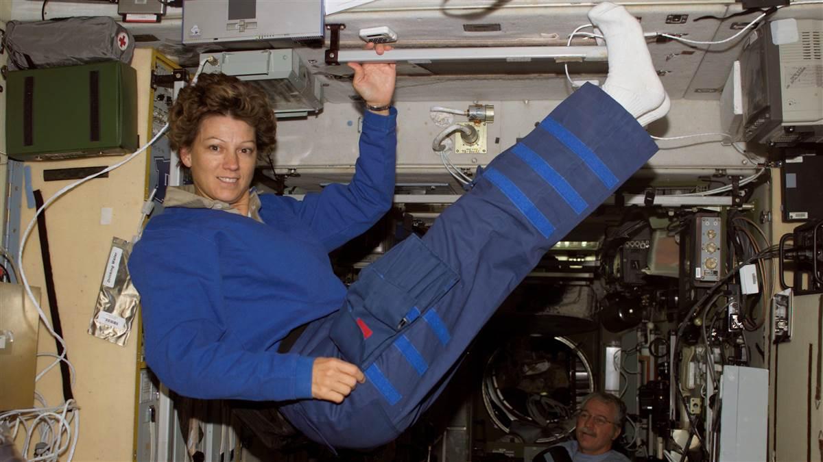 S114-E-7139 (5 August 2005) --- Astronaut Eileen M. Collins, STS-114 commander, floats in the Zvezda Service Module of the International Space Station while Space Shuttle Discovery was docked to the Station. Astronaut John L. Phillips, Expedition 11 NASA Space Station science officer and flight engineer, is visible at bottom right.