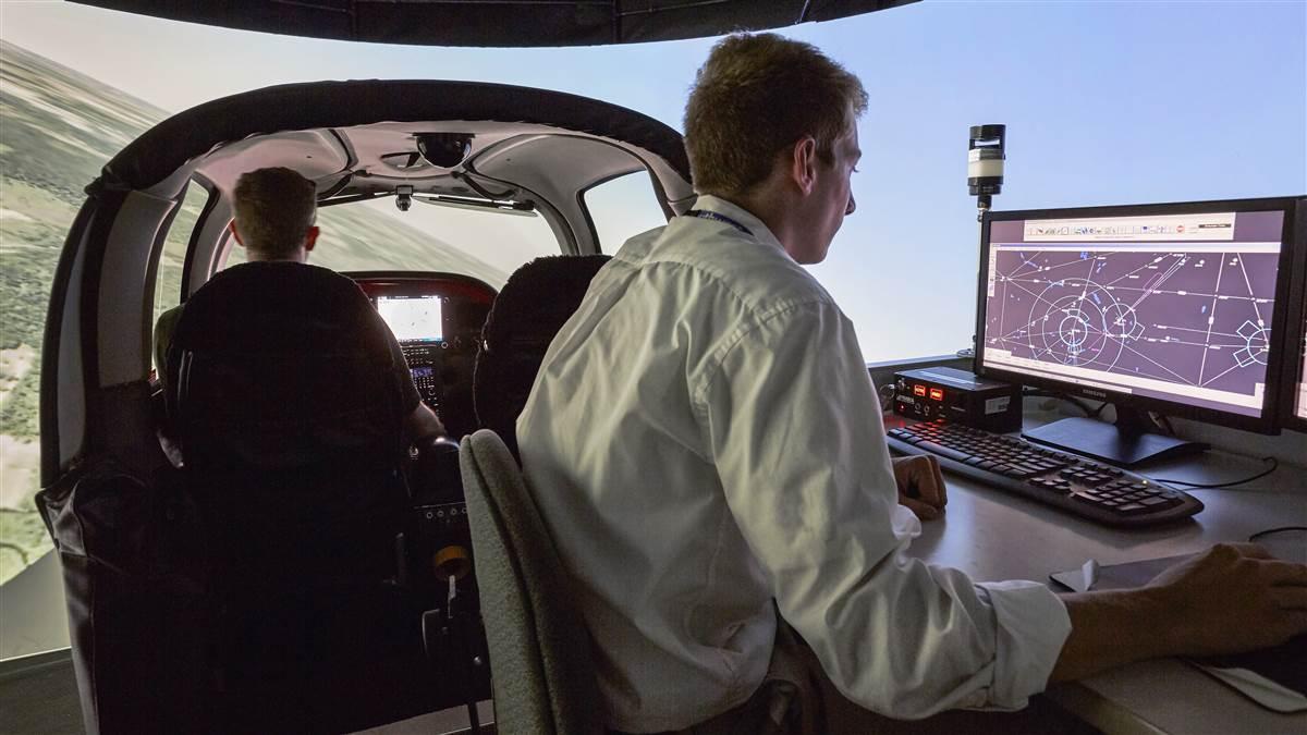 Photography of Western Michigan University College of Aviation students with the school's Cirrus simulators.W.K. Kellogg Airport (BTL)Battle Creek, MI  