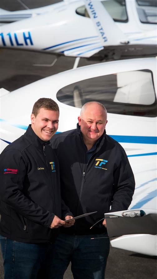 Jake Decker (left) has trained at Take Flight since he was a high school student. He’s now preparing to become a CFI. With Decker is Chief Pilot Ray Wagner.