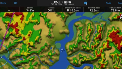 VFR cross-countries sometimes follow rivers and mountain passes—and the path that makes the most sense in terms of geography may not be a straight magenta line on your GPS. The Aviat Husky (below) is flying parallel to Grand Teton in the Rocky Mountains. The other (also a Husky) is following a river from Juneau, Alaska, to the Yukon Territory in Canada.