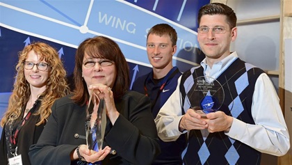 Left to right: Kimberley Hosty, Debra Allen, Distinguished Flight Instructor Tyler Jusko, George Charles Allen.