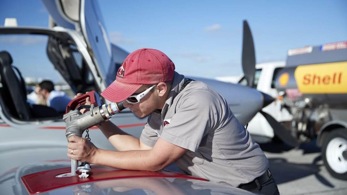 Atlas Aviation lineman fueling a Cirrus at Atlas Aviation.

Peter O'Knight Airport (TPF)
Tampa FL USA