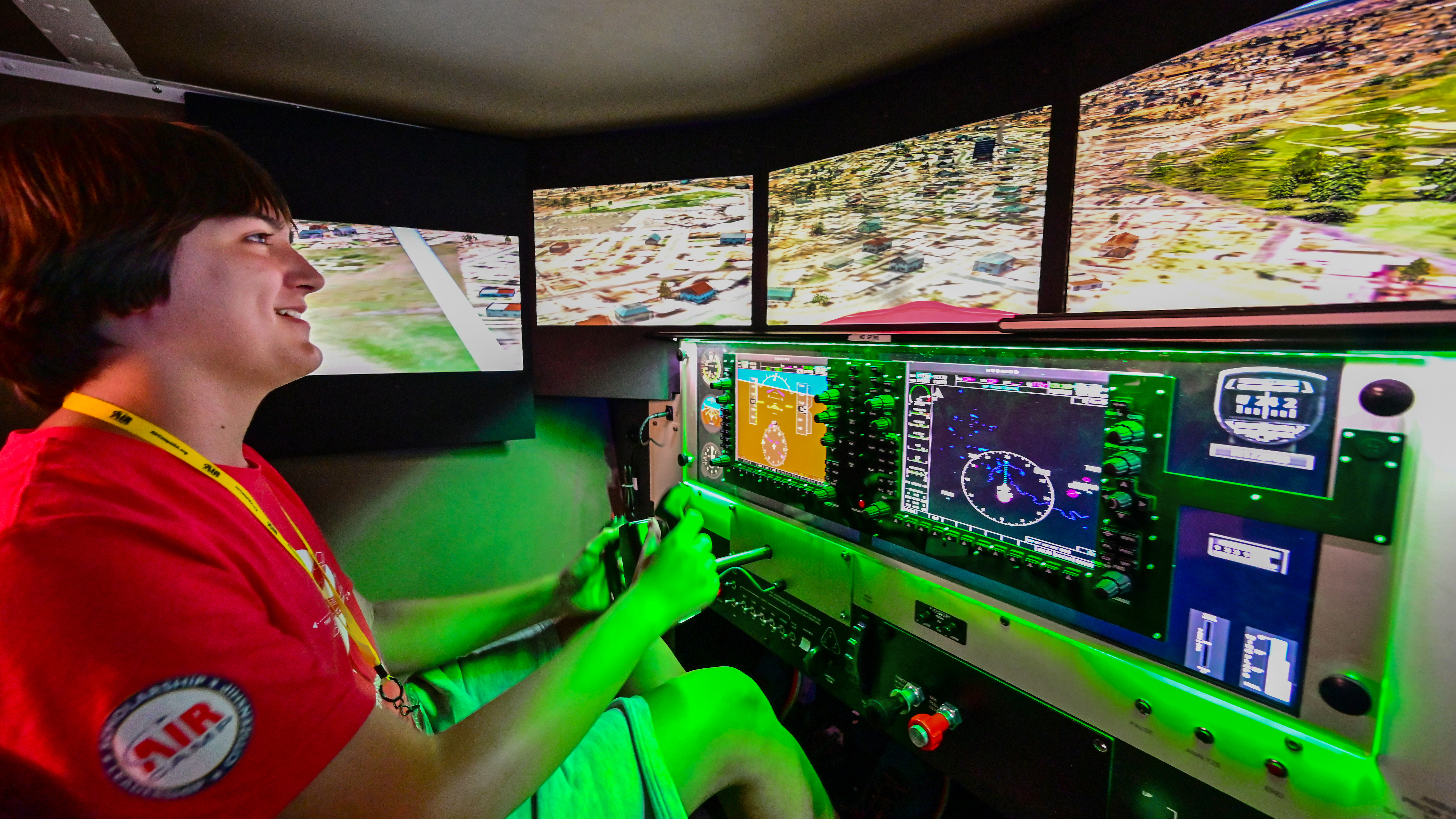 Samuel Martinez-Johnson experiences a simulator flight. "I've always wanted to be a pilot," he said. "This is so cool." Photography by David Tulis