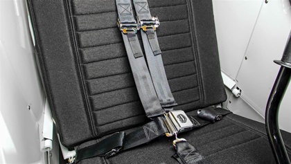 Five-point shoulder harness. In addition to the two waist and shoulder straps, a fifth strap goes between the legs. Aerobatics, anyone?