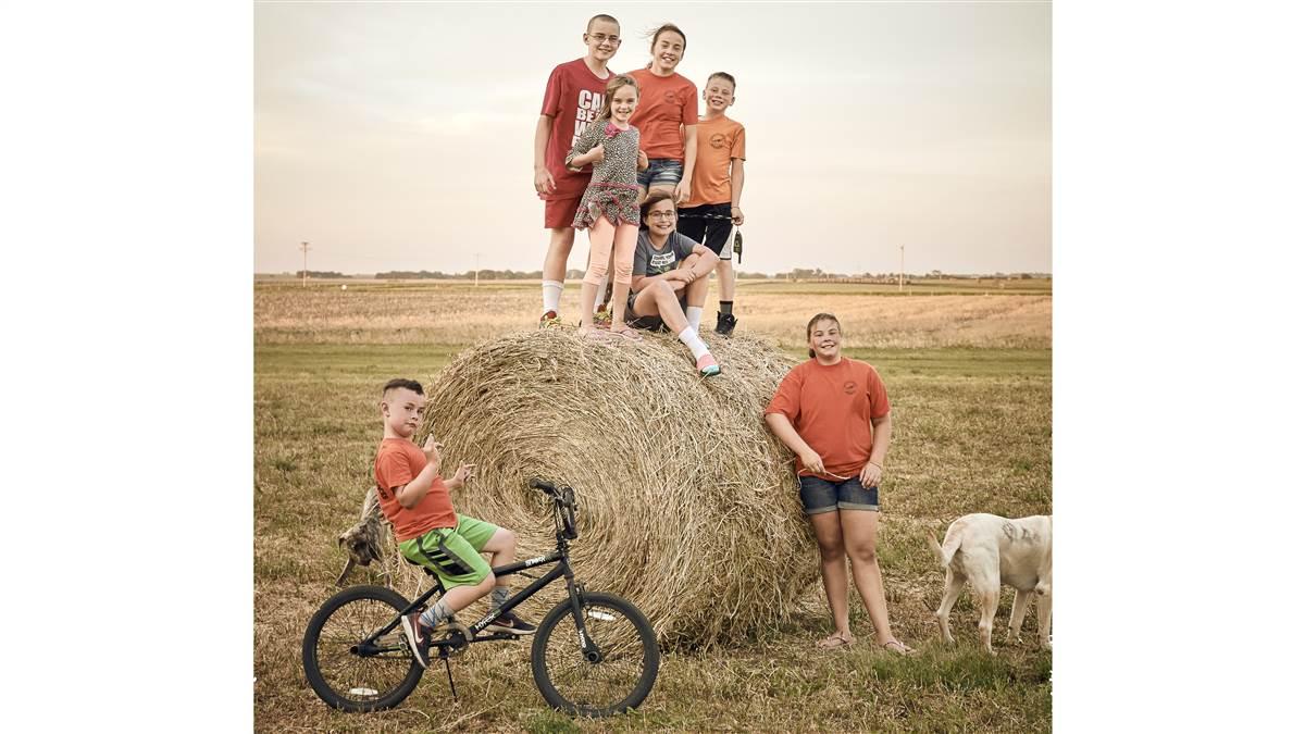 The Hoffman grandchildren (clockwise from left): Hayden, Jack (in red on hay bale), Reese, Lauryn, Ava, Hudson, and Amelia. 