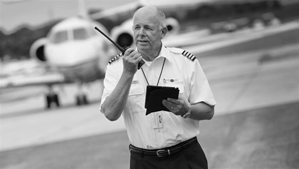 A pilot shirt, black pants and shoes, and captain's epaulets command respect in many parts of the world. Icom IC-A6 aviation radio $254.95, www.sportys.com, www.icomamerica.com