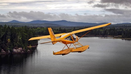 The Aeroprakt A–22 flies over Moosehead Lake in Maine.